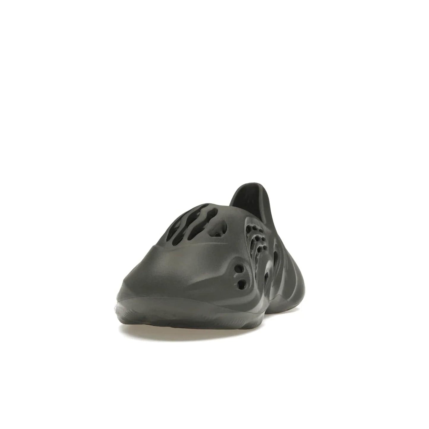 adidas Yeezy Foam RNR Carbon - Image 12 - Only at www.BallersClubKickz.com - Experience truly next-level comfort with the adidas Yeezy Foam RNR Carbon. With its one-piece foam and rubber construction, strategic perforations for optimal breathability, and sleek Carbon colorway, the sneaker is an unrelenting testament to Yeezy innovation. Available August 8, 2023, for $80.