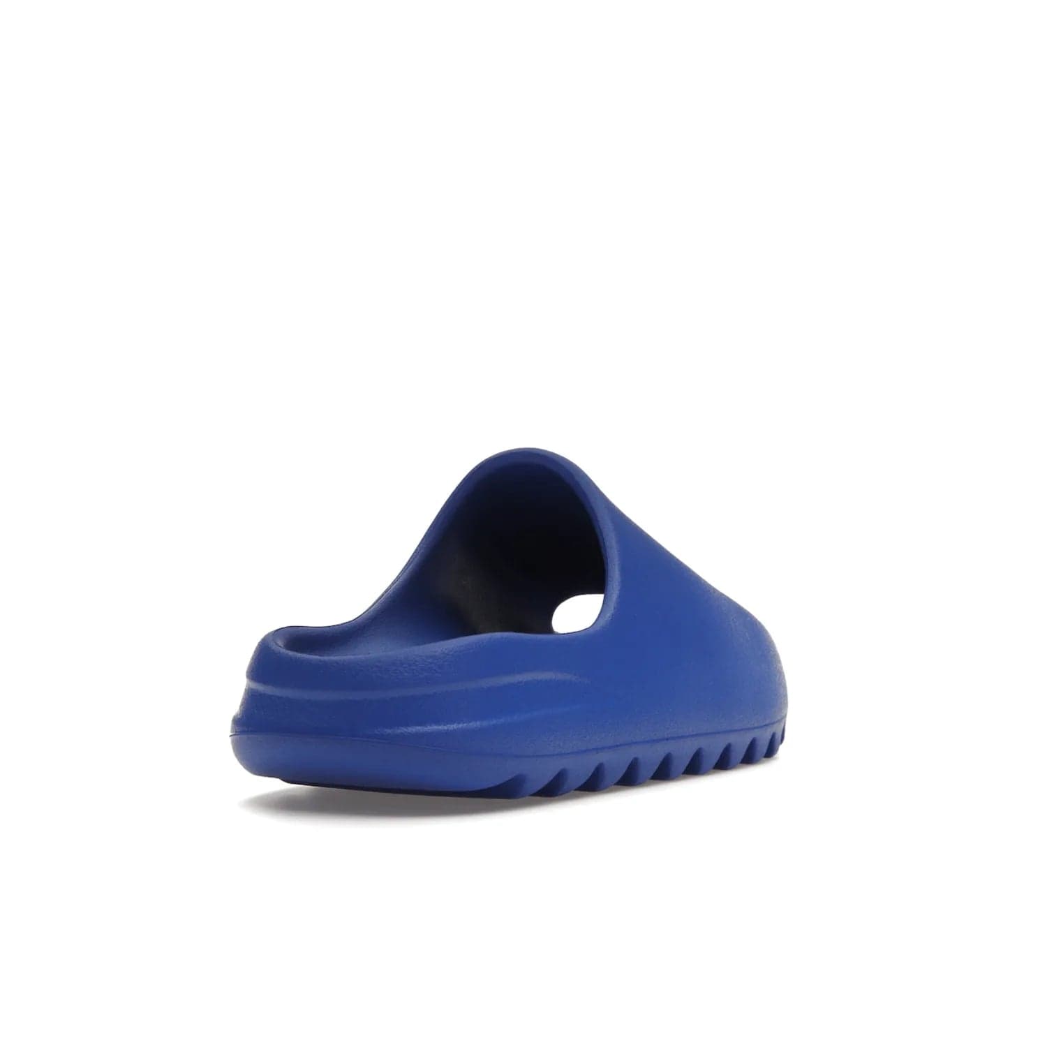 adidas Yeezy Slide Azure - Image 31 - Only at www.BallersClubKickz.com - Elevate your look with the adidas Yeezy Slide Azure. Boasting a vibrant hue for a unique style, this EVA foam slide is a statement of fearlessness and stylish expression. Step out with confidence knowing you're wearing more than a slide.