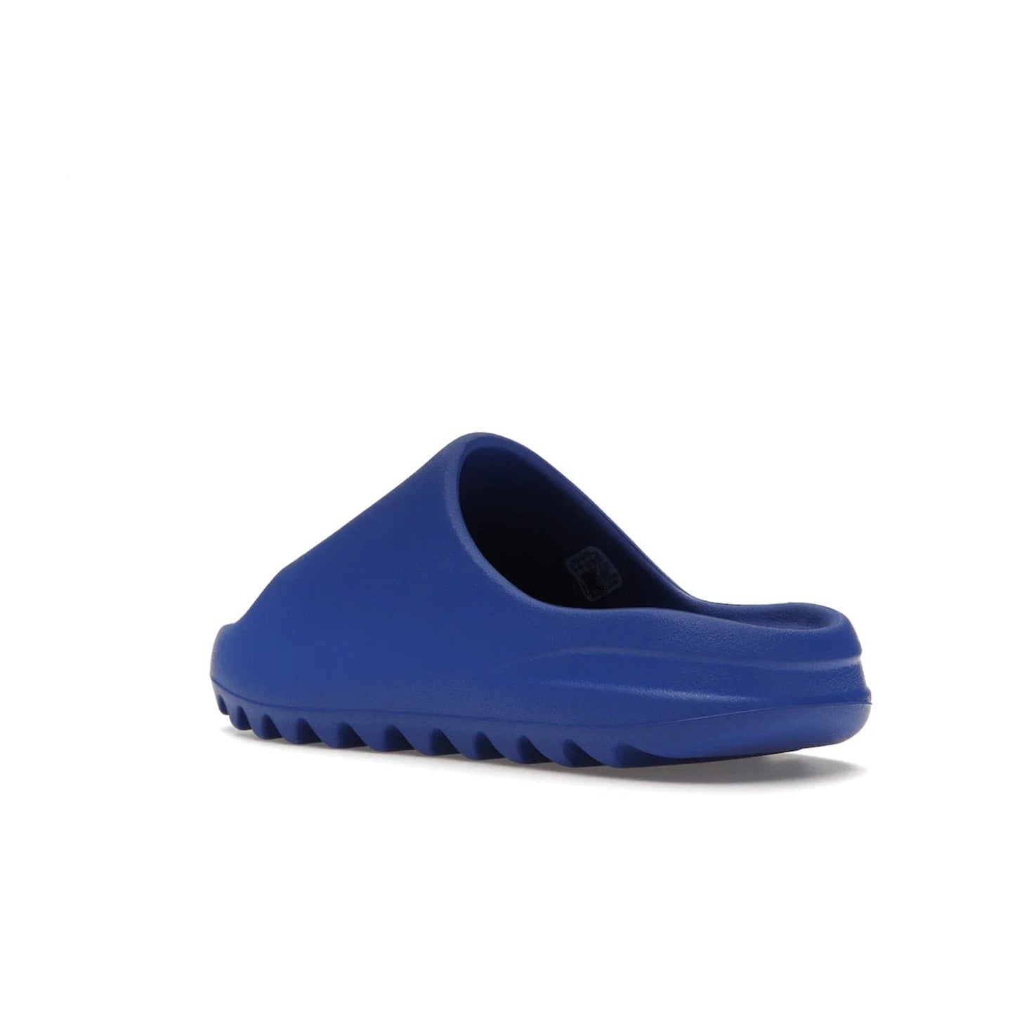 adidas Yeezy Slide Azure - Image 24 - Only at www.BallersClubKickz.com - Elevate your look with the adidas Yeezy Slide Azure. Boasting a vibrant hue for a unique style, this EVA foam slide is a statement of fearlessness and stylish expression. Step out with confidence knowing you're wearing more than a slide.
