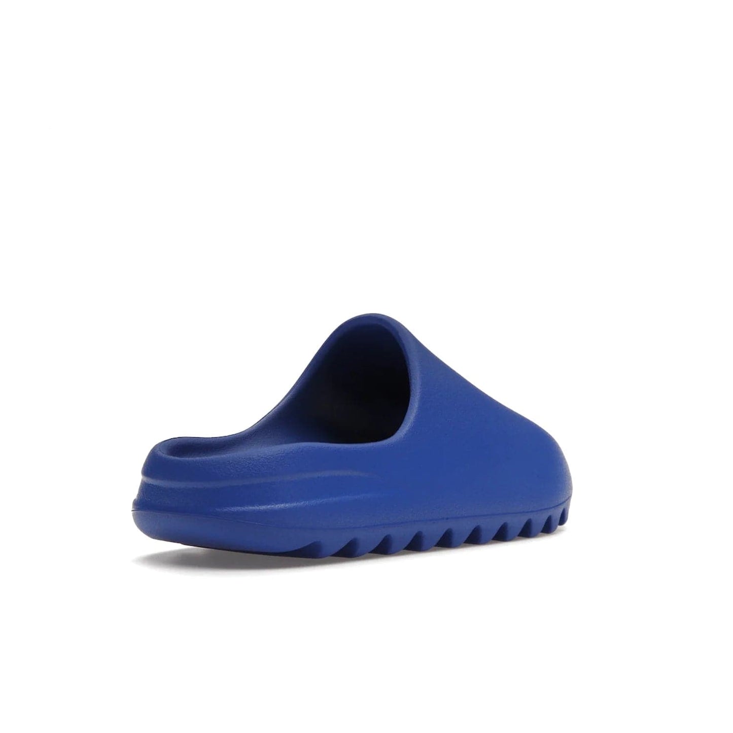 adidas Yeezy Slide Azure - Image 32 - Only at www.BallersClubKickz.com - Elevate your look with the adidas Yeezy Slide Azure. Boasting a vibrant hue for a unique style, this EVA foam slide is a statement of fearlessness and stylish expression. Step out with confidence knowing you're wearing more than a slide.
