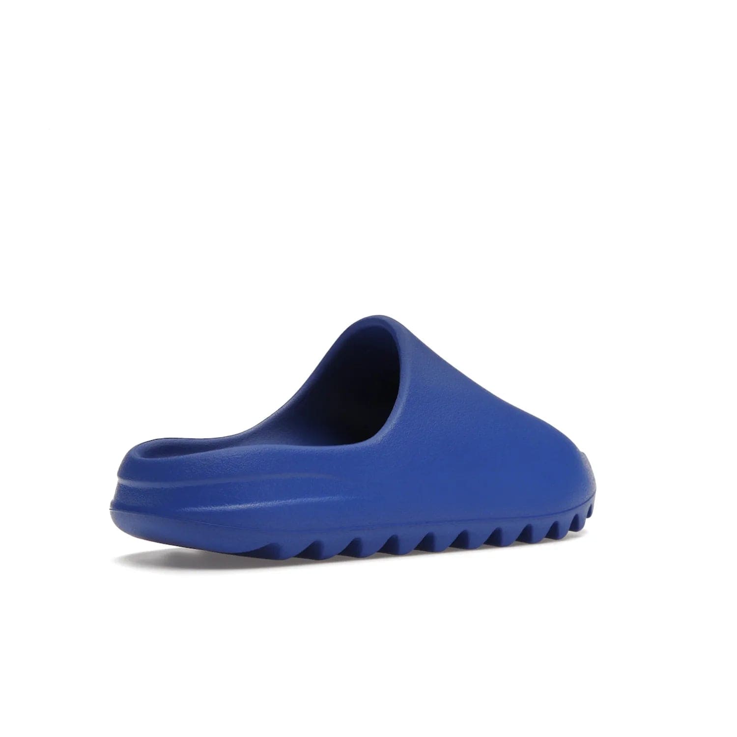 adidas Yeezy Slide Azure - Image 33 - Only at www.BallersClubKickz.com - Elevate your look with the adidas Yeezy Slide Azure. Boasting a vibrant hue for a unique style, this EVA foam slide is a statement of fearlessness and stylish expression. Step out with confidence knowing you're wearing more than a slide.