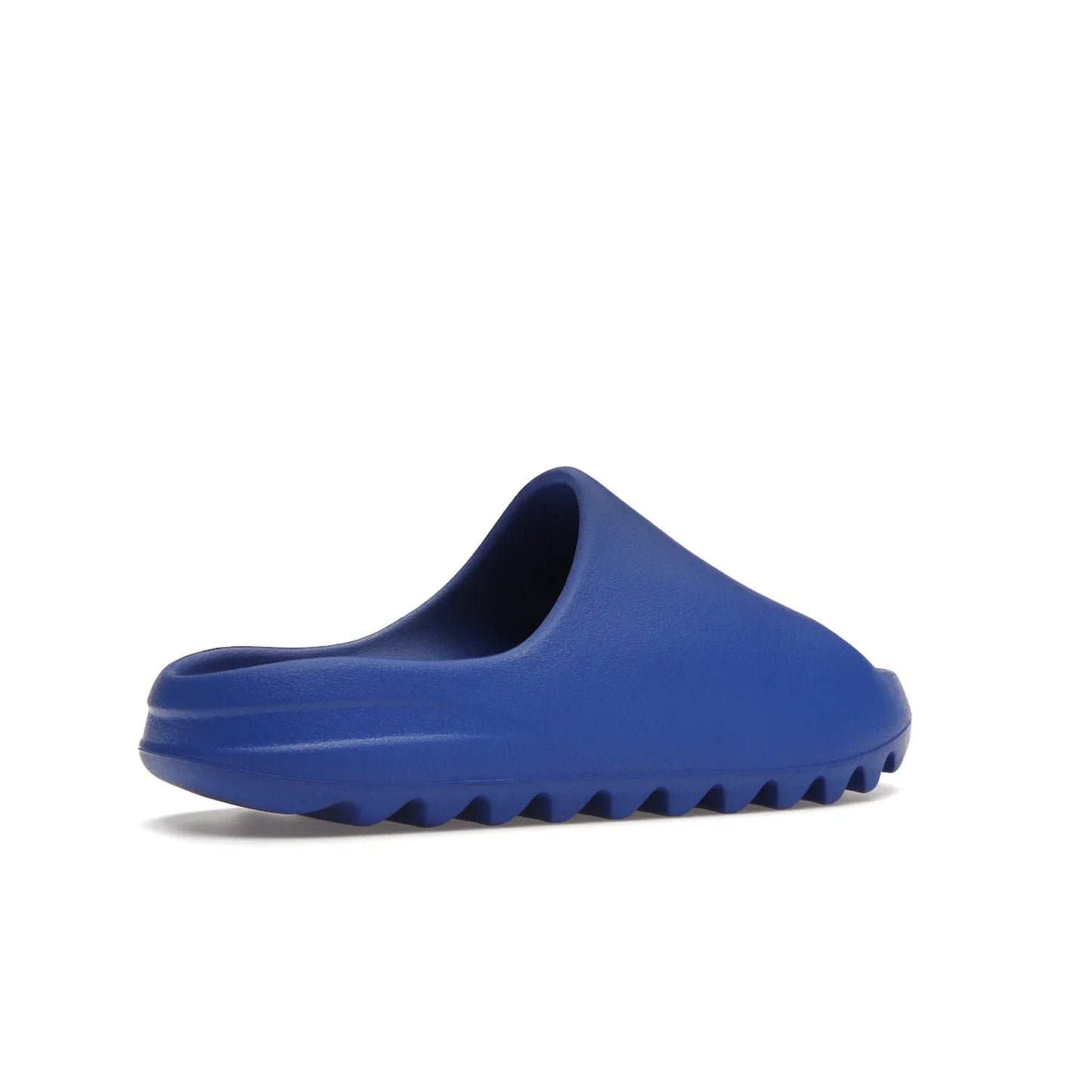 adidas Yeezy Slide Azure - Image 34 - Only at www.BallersClubKickz.com - Elevate your look with the adidas Yeezy Slide Azure. Boasting a vibrant hue for a unique style, this EVA foam slide is a statement of fearlessness and stylish expression. Step out with confidence knowing you're wearing more than a slide.