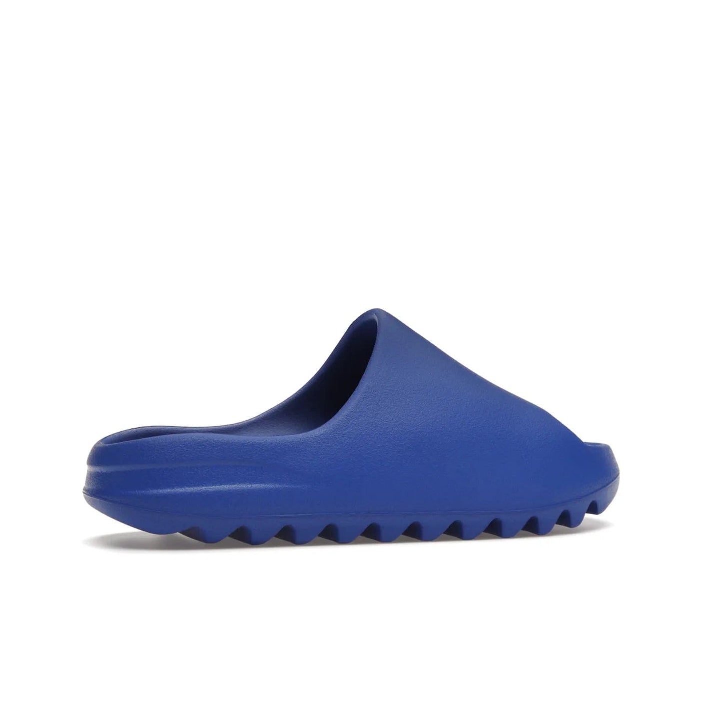 adidas Yeezy Slide Azure - Image 35 - Only at www.BallersClubKickz.com - Elevate your look with the adidas Yeezy Slide Azure. Boasting a vibrant hue for a unique style, this EVA foam slide is a statement of fearlessness and stylish expression. Step out with confidence knowing you're wearing more than a slide.