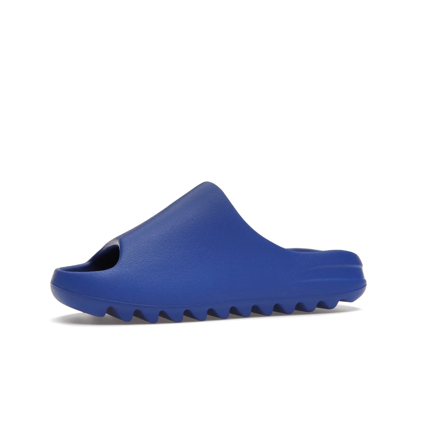 adidas Yeezy Slide Azure - Image 17 - Only at www.BallersClubKickz.com - Elevate your look with the adidas Yeezy Slide Azure. Boasting a vibrant hue for a unique style, this EVA foam slide is a statement of fearlessness and stylish expression. Step out with confidence knowing you're wearing more than a slide.