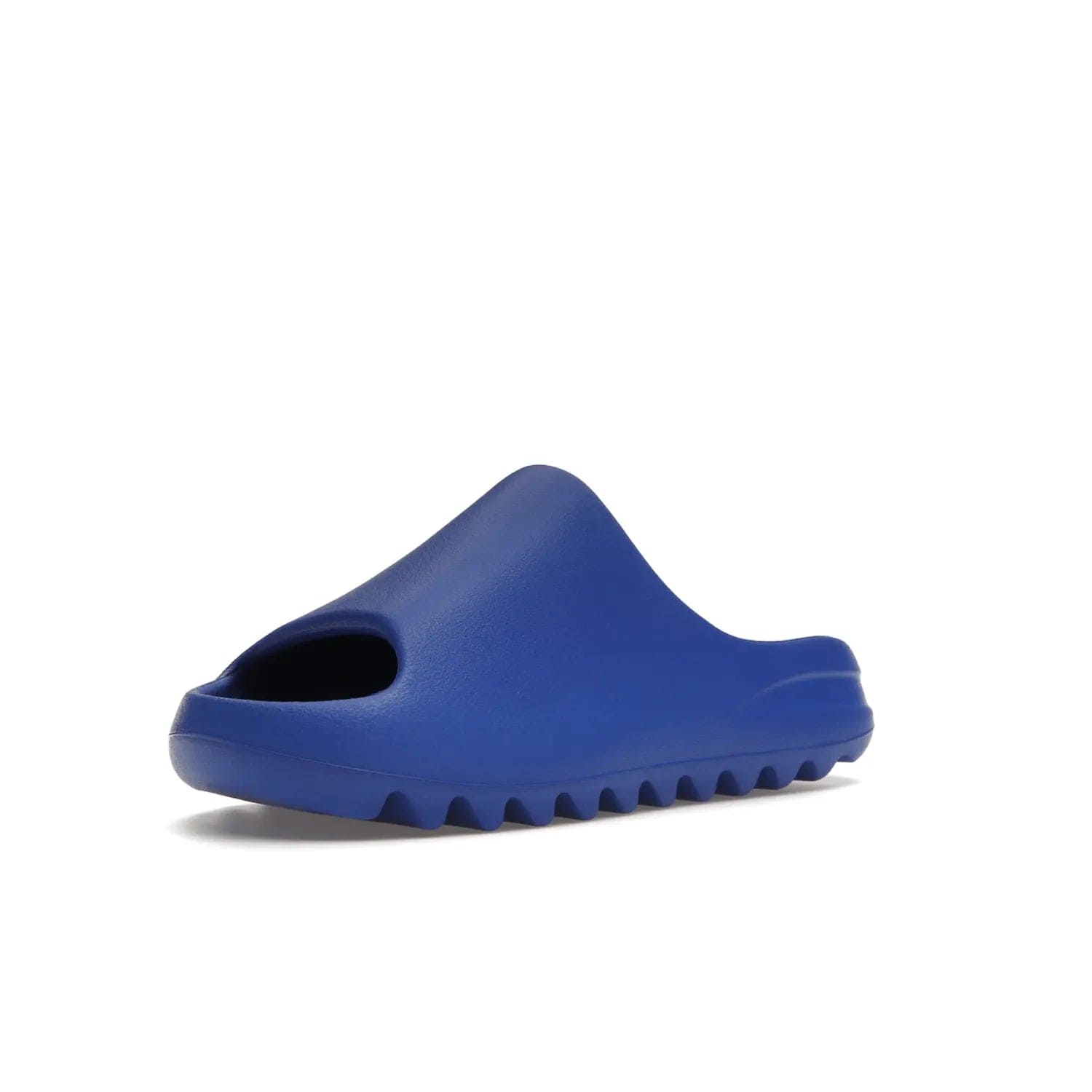 adidas Yeezy Slide Azure - Image 15 - Only at www.BallersClubKickz.com - Elevate your look with the adidas Yeezy Slide Azure. Boasting a vibrant hue for a unique style, this EVA foam slide is a statement of fearlessness and stylish expression. Step out with confidence knowing you're wearing more than a slide.