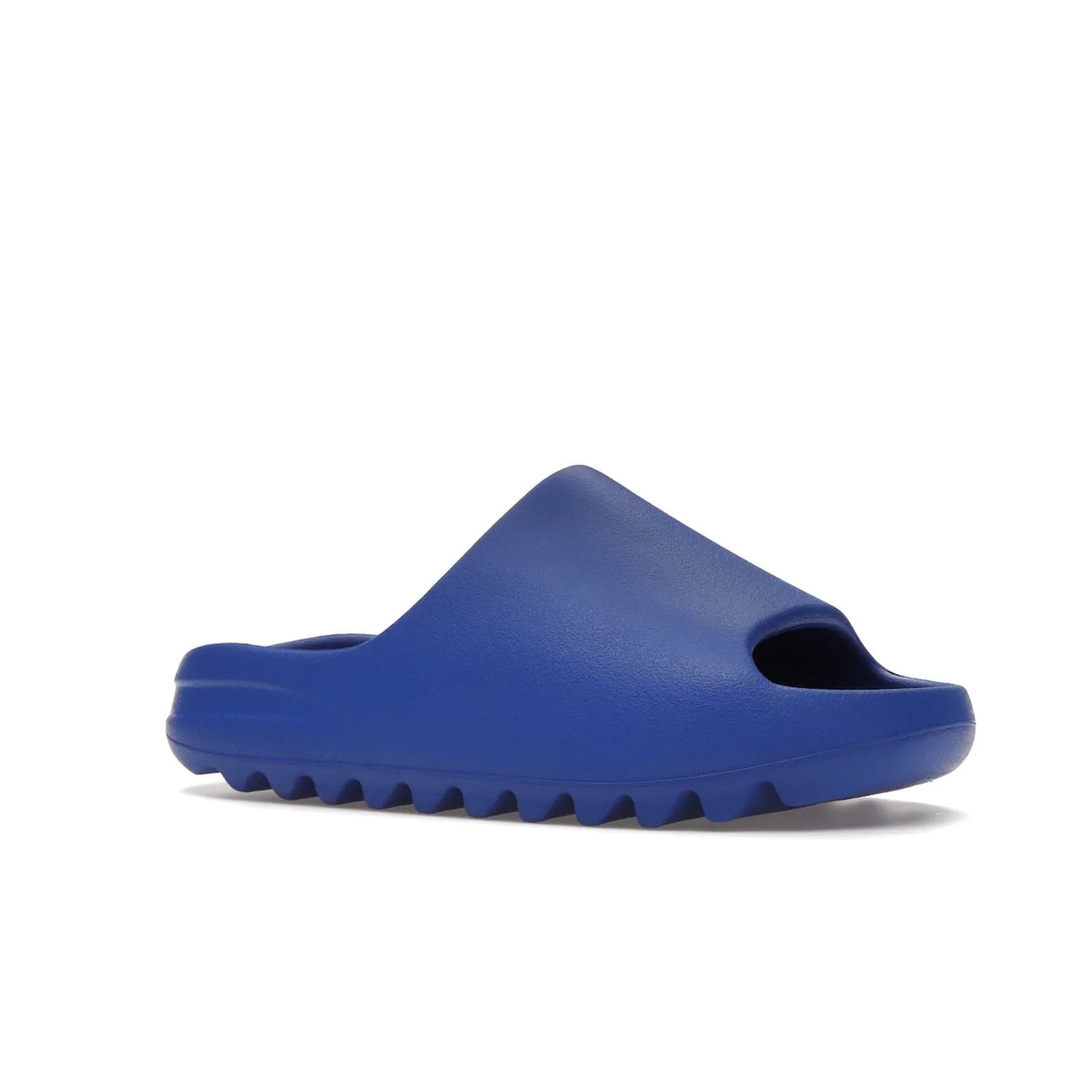 adidas Yeezy Slide Azure - Image 4 - Only at www.BallersClubKickz.com - Elevate your look with the adidas Yeezy Slide Azure. Boasting a vibrant hue for a unique style, this EVA foam slide is a statement of fearlessness and stylish expression. Step out with confidence knowing you're wearing more than a slide.