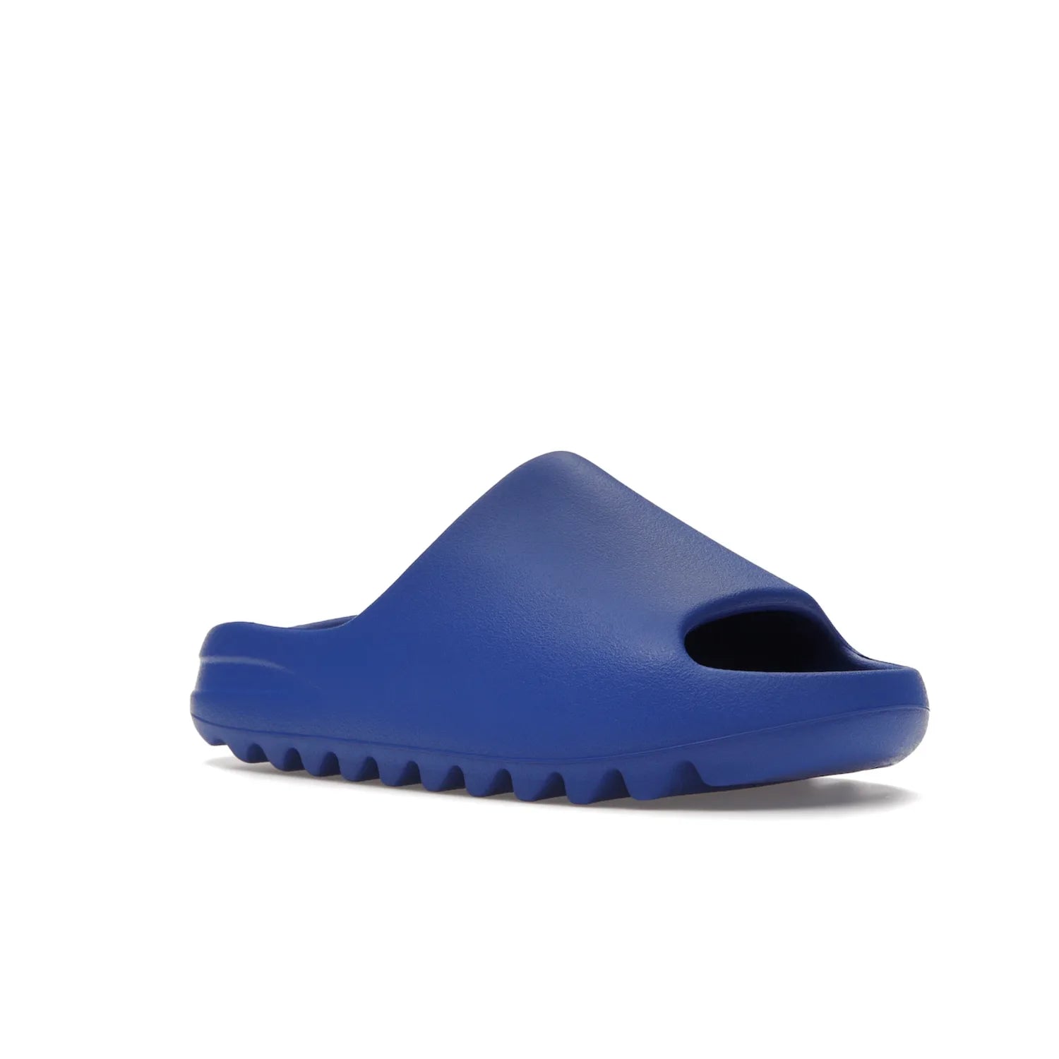 adidas Yeezy Slide Azure - Image 5 - Only at www.BallersClubKickz.com - Elevate your look with the adidas Yeezy Slide Azure. Boasting a vibrant hue for a unique style, this EVA foam slide is a statement of fearlessness and stylish expression. Step out with confidence knowing you're wearing more than a slide.