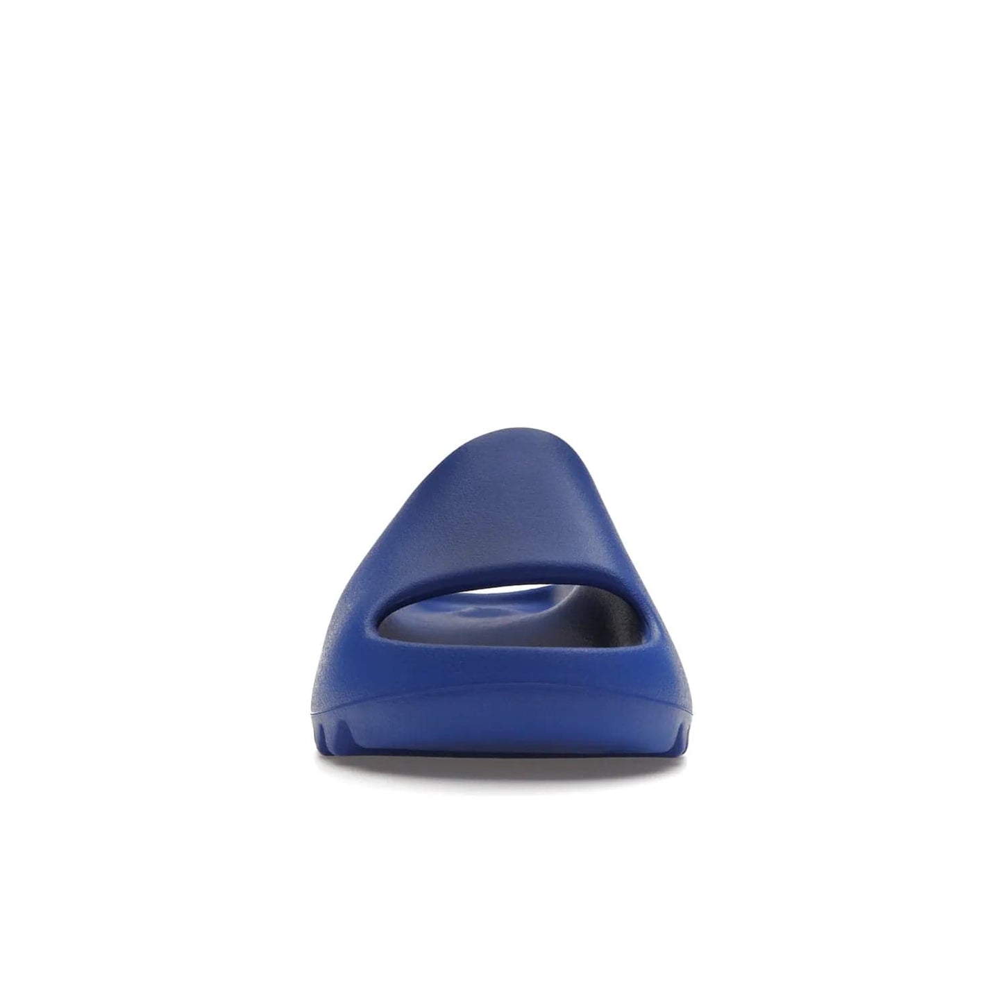 adidas Yeezy Slide Azure - Image 10 - Only at www.BallersClubKickz.com - Elevate your look with the adidas Yeezy Slide Azure. Boasting a vibrant hue for a unique style, this EVA foam slide is a statement of fearlessness and stylish expression. Step out with confidence knowing you're wearing more than a slide.