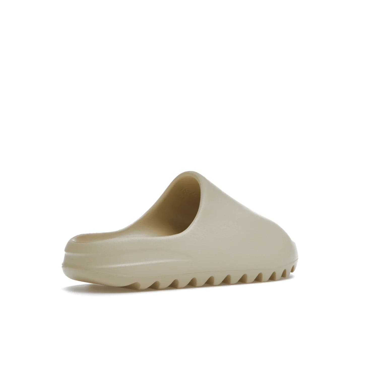 adidas Yeezy Slide Bone (2022 Restock) - Image 33 - Only at www.BallersClubKickz.com - Stay comfy with the adidas Yeezy Slide Bone - a fashionable silhouette with all-day comfort. This Bone/Bone/Bone colorway combines style and comfort with a pebbled texture and grooved sole. Restocked in May 2022, this shoe is the perfect addition to your collection.