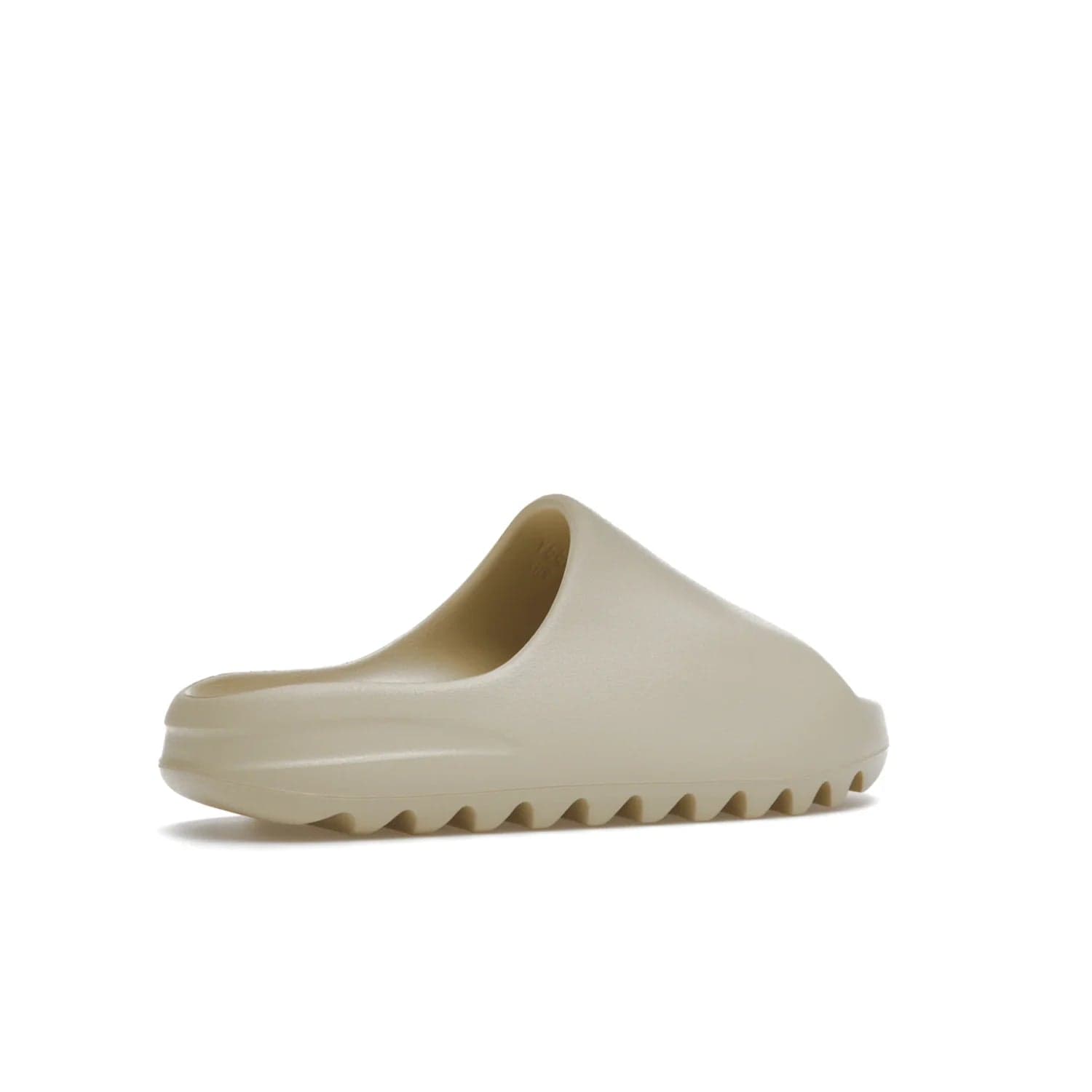 adidas Yeezy Slide Bone (2022 Restock) - Image 34 - Only at www.BallersClubKickz.com - Stay comfy with the adidas Yeezy Slide Bone - a fashionable silhouette with all-day comfort. This Bone/Bone/Bone colorway combines style and comfort with a pebbled texture and grooved sole. Restocked in May 2022, this shoe is the perfect addition to your collection.