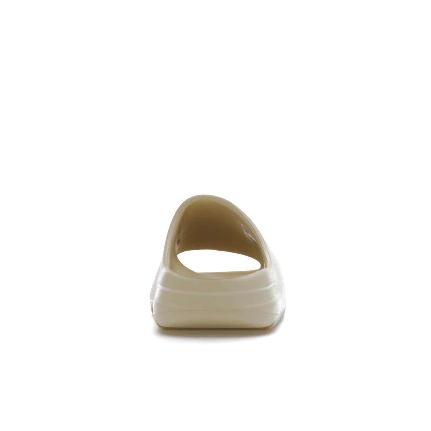 adidas Yeezy Slide Bone (2022 Restock) - Image 28 - Only at www.BallersClubKickz.com - Stay comfy with the adidas Yeezy Slide Bone - a fashionable silhouette with all-day comfort. This Bone/Bone/Bone colorway combines style and comfort with a pebbled texture and grooved sole. Restocked in May 2022, this shoe is the perfect addition to your collection.