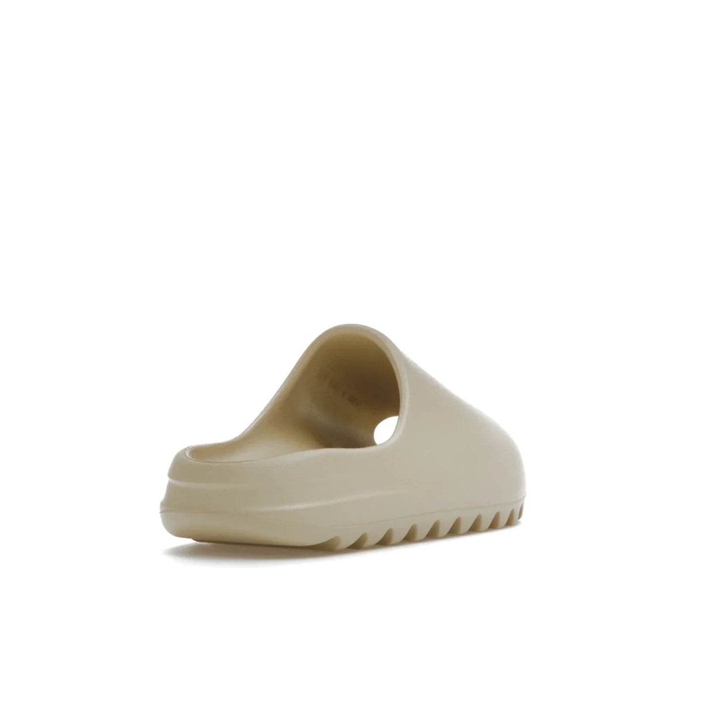 adidas Yeezy Slide Bone (2022 Restock) - Image 31 - Only at www.BallersClubKickz.com - Stay comfy with the adidas Yeezy Slide Bone - a fashionable silhouette with all-day comfort. This Bone/Bone/Bone colorway combines style and comfort with a pebbled texture and grooved sole. Restocked in May 2022, this shoe is the perfect addition to your collection.