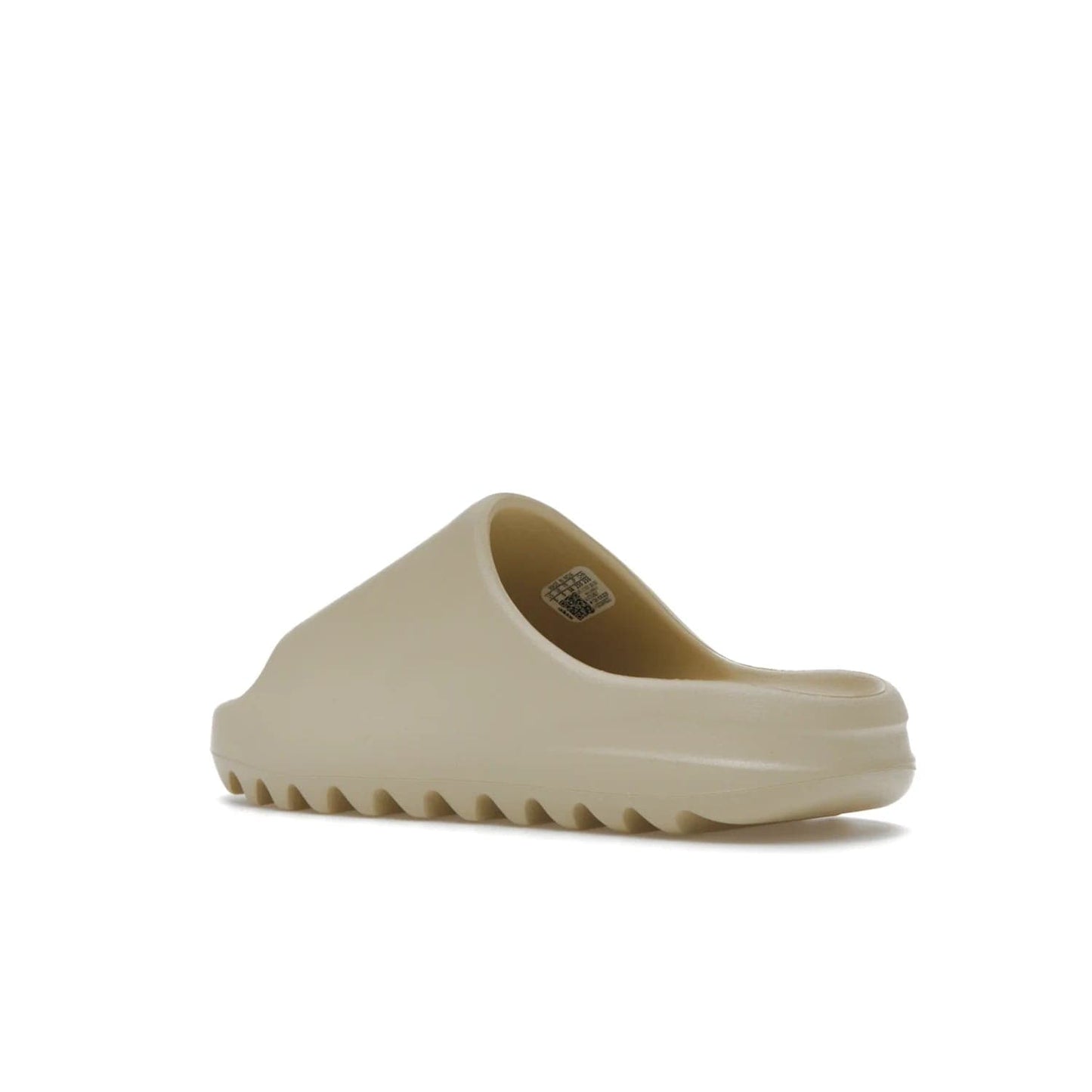 adidas Yeezy Slide Bone (2022 Restock) - Image 23 - Only at www.BallersClubKickz.com - Stay comfy with the adidas Yeezy Slide Bone - a fashionable silhouette with all-day comfort. This Bone/Bone/Bone colorway combines style and comfort with a pebbled texture and grooved sole. Restocked in May 2022, this shoe is the perfect addition to your collection.