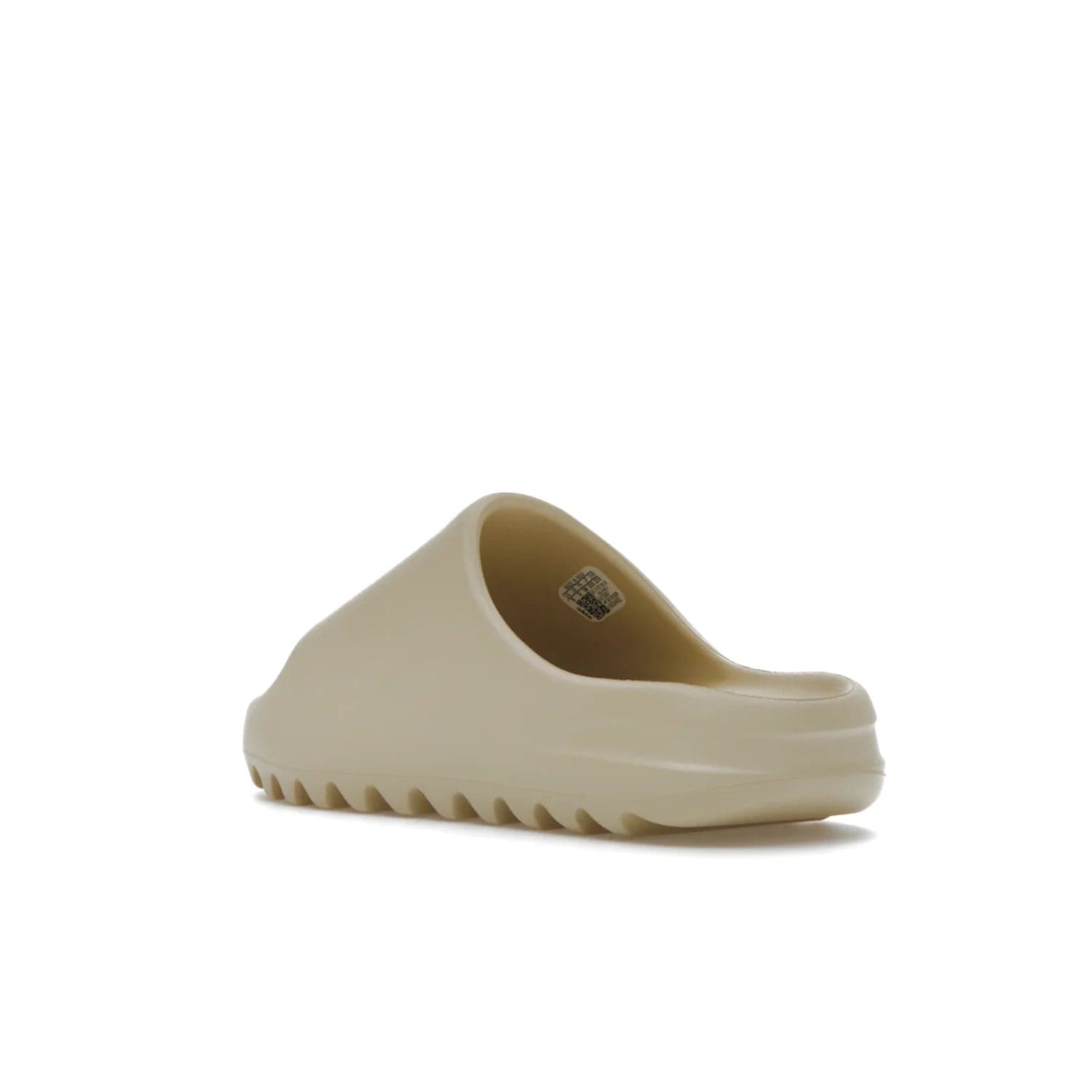 adidas Yeezy Slide Bone (2022 Restock) - Image 24 - Only at www.BallersClubKickz.com - Stay comfy with the adidas Yeezy Slide Bone - a fashionable silhouette with all-day comfort. This Bone/Bone/Bone colorway combines style and comfort with a pebbled texture and grooved sole. Restocked in May 2022, this shoe is the perfect addition to your collection.