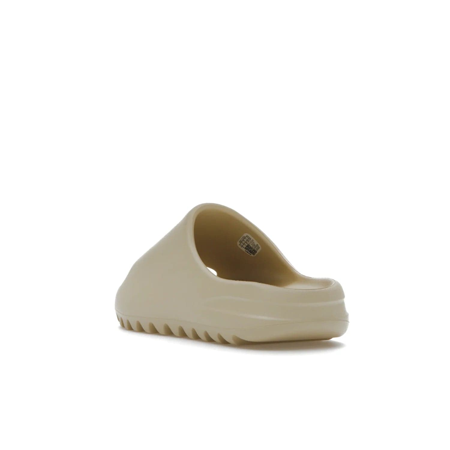 adidas Yeezy Slide Bone (2022 Restock) - Image 25 - Only at www.BallersClubKickz.com - Stay comfy with the adidas Yeezy Slide Bone - a fashionable silhouette with all-day comfort. This Bone/Bone/Bone colorway combines style and comfort with a pebbled texture and grooved sole. Restocked in May 2022, this shoe is the perfect addition to your collection.