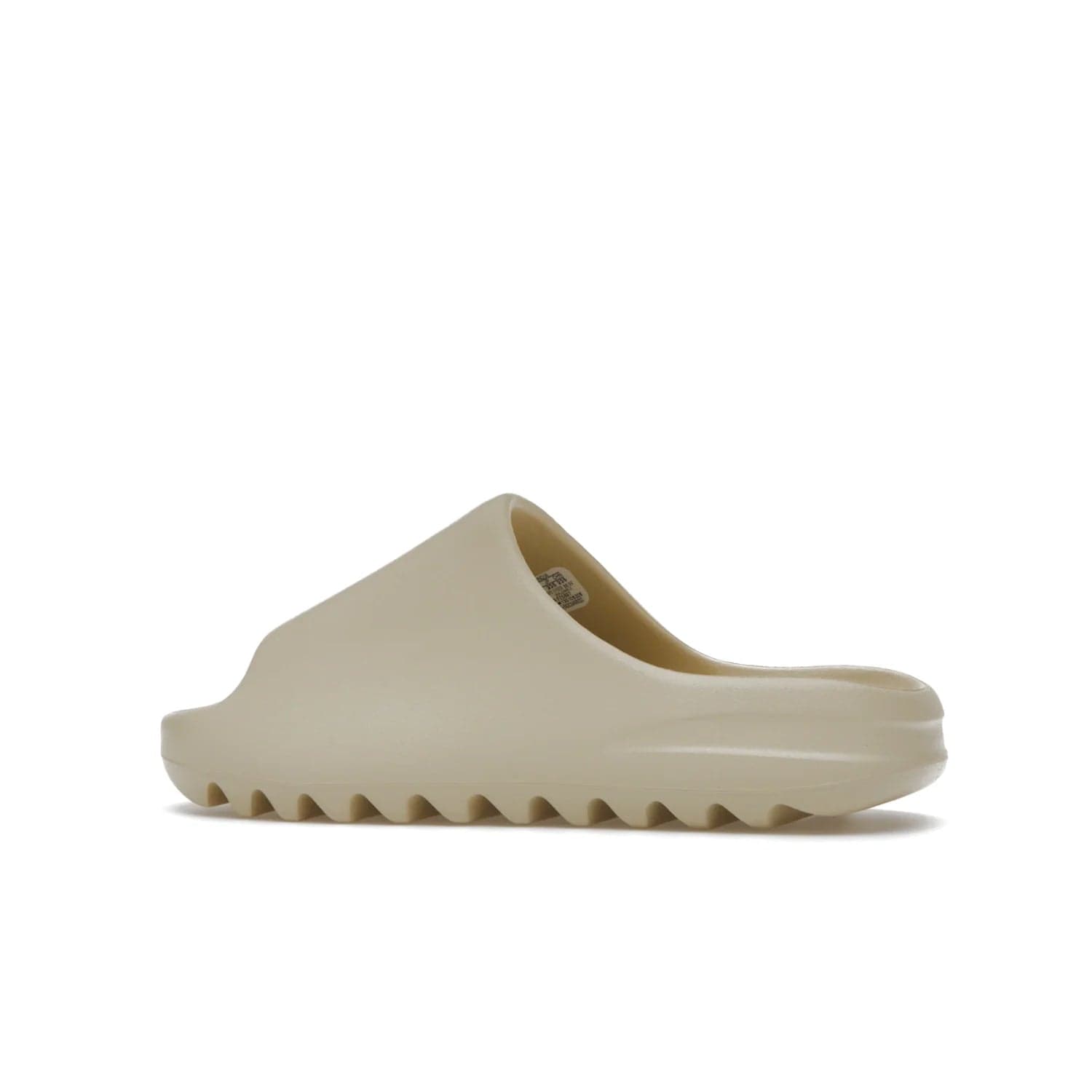 adidas Yeezy Slide Bone (2022 Restock) - Image 21 - Only at www.BallersClubKickz.com - Stay comfy with the adidas Yeezy Slide Bone - a fashionable silhouette with all-day comfort. This Bone/Bone/Bone colorway combines style and comfort with a pebbled texture and grooved sole. Restocked in May 2022, this shoe is the perfect addition to your collection.