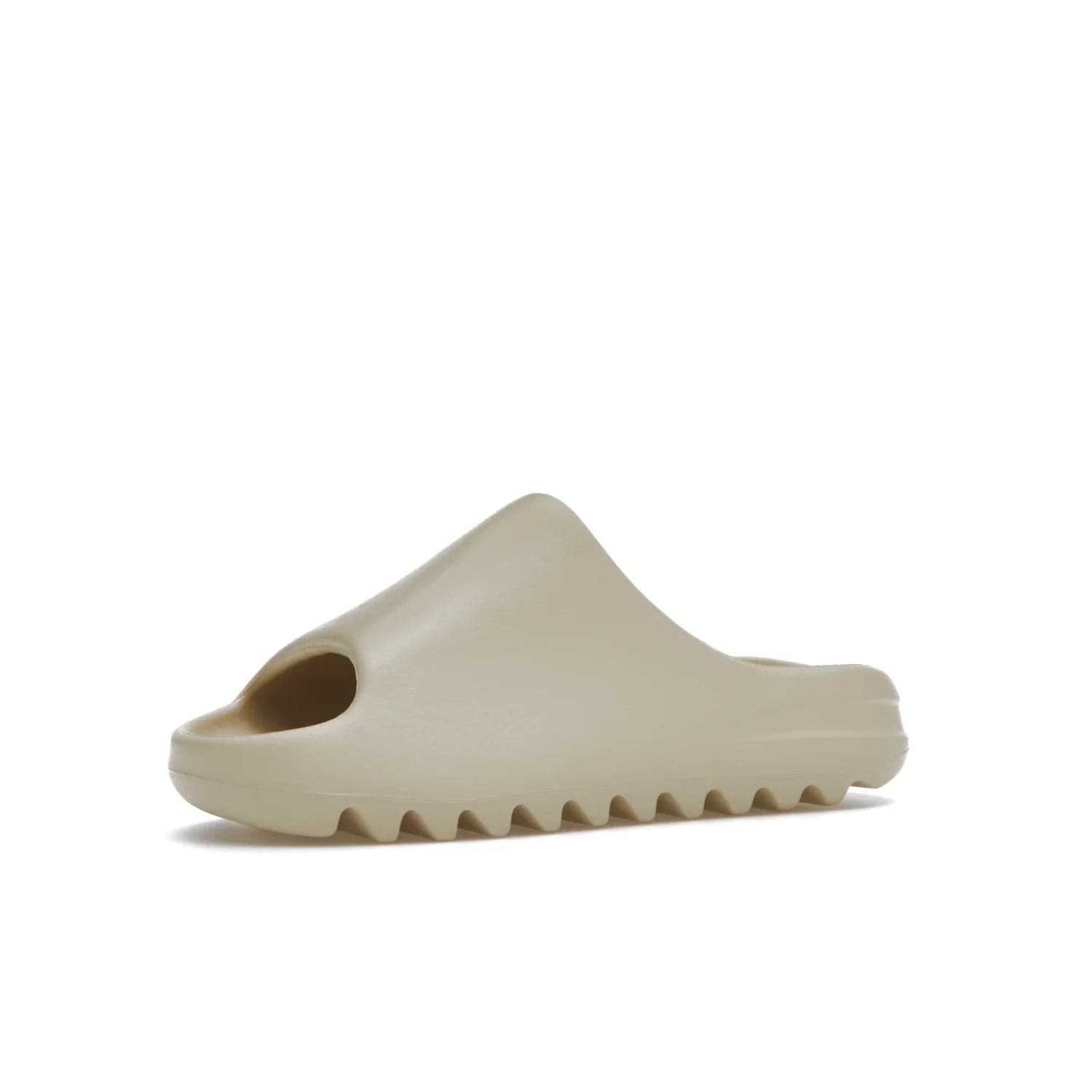 adidas Yeezy Slide Bone (2022 Restock) - Image 16 - Only at www.BallersClubKickz.com - Stay comfy with the adidas Yeezy Slide Bone - a fashionable silhouette with all-day comfort. This Bone/Bone/Bone colorway combines style and comfort with a pebbled texture and grooved sole. Restocked in May 2022, this shoe is the perfect addition to your collection.