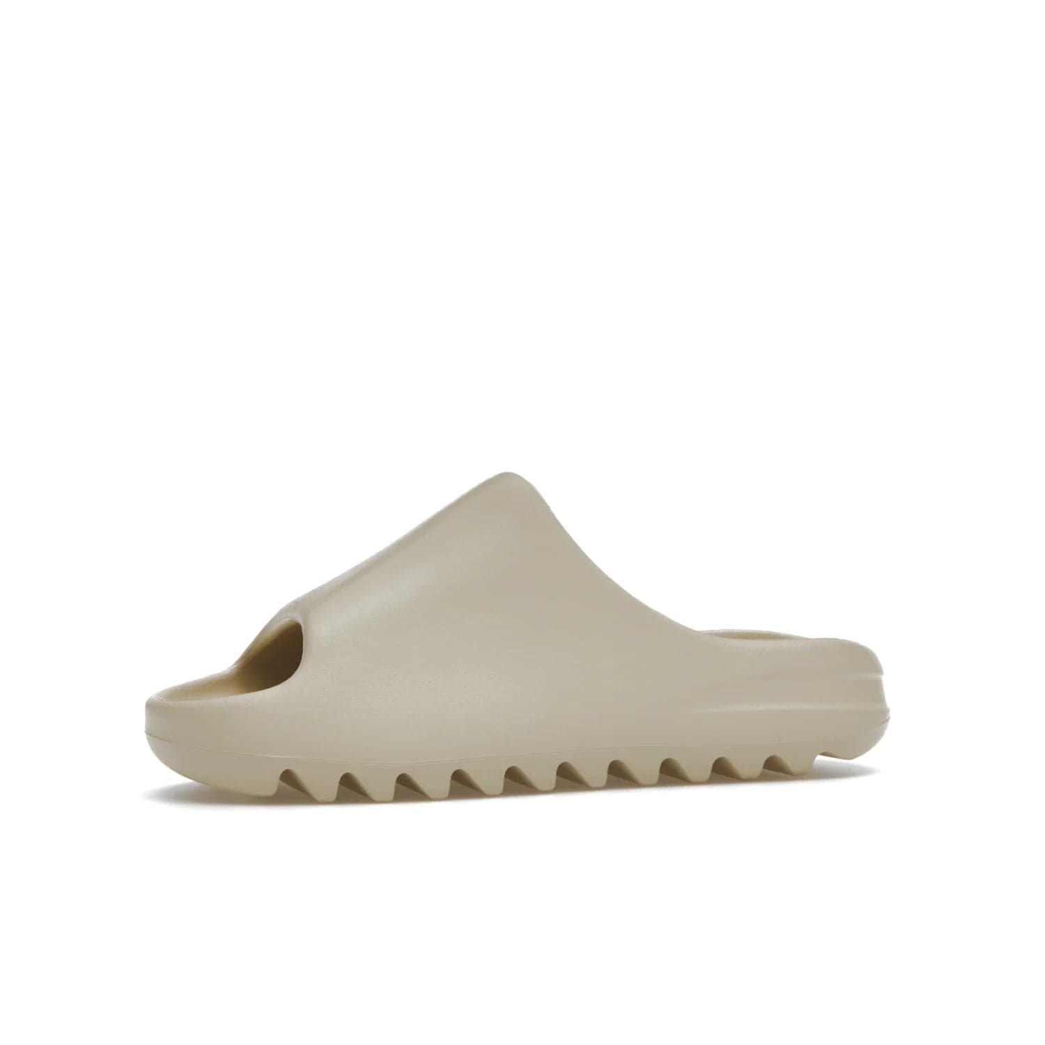 adidas Yeezy Slide Bone (2022 Restock) - Image 17 - Only at www.BallersClubKickz.com - Stay comfy with the adidas Yeezy Slide Bone - a fashionable silhouette with all-day comfort. This Bone/Bone/Bone colorway combines style and comfort with a pebbled texture and grooved sole. Restocked in May 2022, this shoe is the perfect addition to your collection.