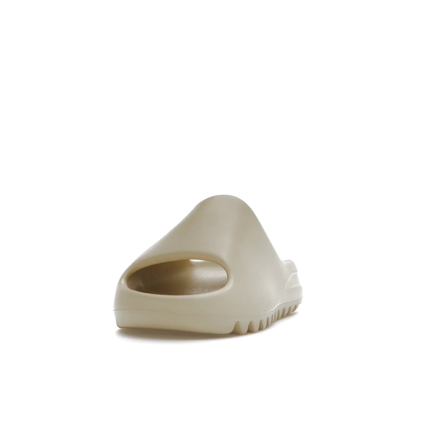adidas Yeezy Slide Bone (2022 Restock) - Image 12 - Only at www.BallersClubKickz.com - Stay comfy with the adidas Yeezy Slide Bone - a fashionable silhouette with all-day comfort. This Bone/Bone/Bone colorway combines style and comfort with a pebbled texture and grooved sole. Restocked in May 2022, this shoe is the perfect addition to your collection.