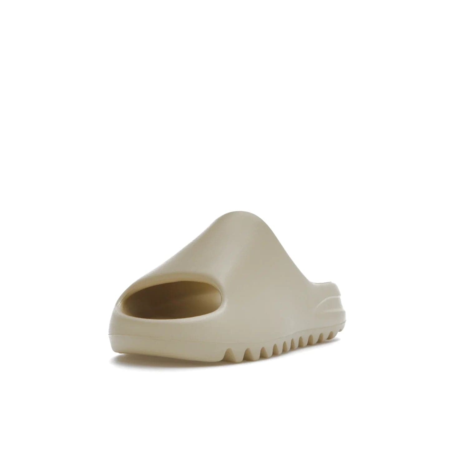 adidas Yeezy Slide Bone (2022 Restock) - Image 13 - Only at www.BallersClubKickz.com - Stay comfy with the adidas Yeezy Slide Bone - a fashionable silhouette with all-day comfort. This Bone/Bone/Bone colorway combines style and comfort with a pebbled texture and grooved sole. Restocked in May 2022, this shoe is the perfect addition to your collection.