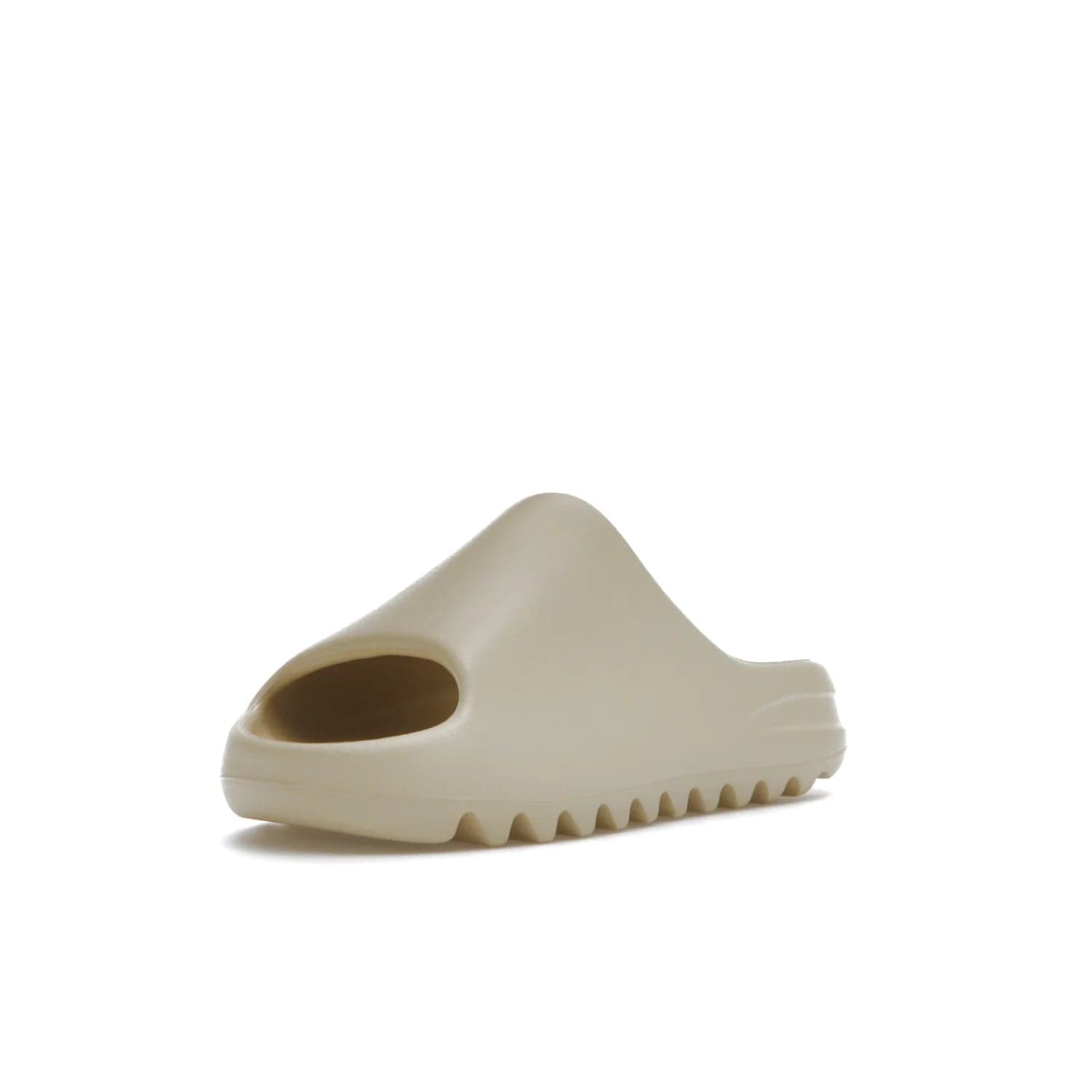 adidas Yeezy Slide Bone (2022 Restock) - Image 14 - Only at www.BallersClubKickz.com - Stay comfy with the adidas Yeezy Slide Bone - a fashionable silhouette with all-day comfort. This Bone/Bone/Bone colorway combines style and comfort with a pebbled texture and grooved sole. Restocked in May 2022, this shoe is the perfect addition to your collection.