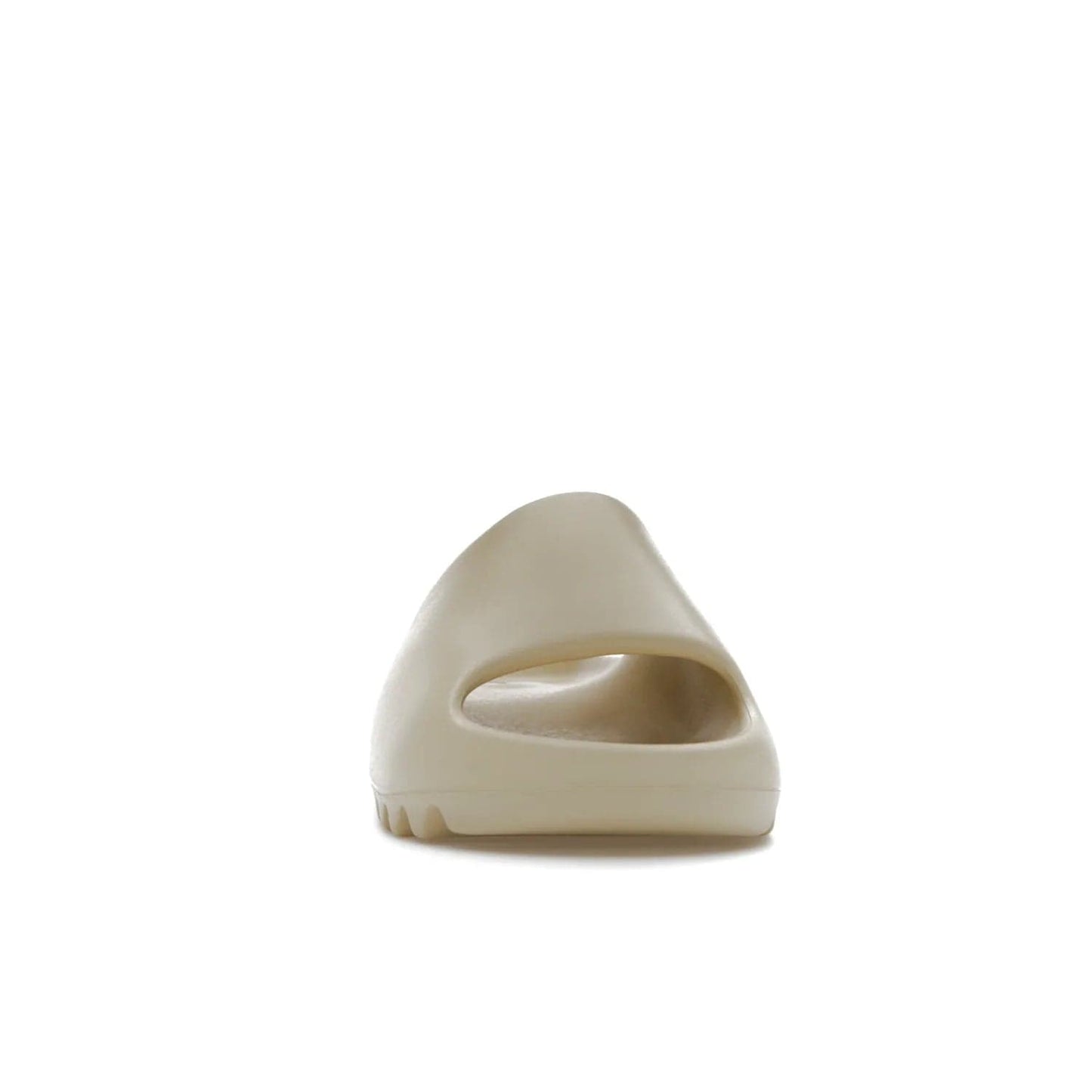 adidas Yeezy Slide Bone (2022 Restock) - Image 9 - Only at www.BallersClubKickz.com - Stay comfy with the adidas Yeezy Slide Bone - a fashionable silhouette with all-day comfort. This Bone/Bone/Bone colorway combines style and comfort with a pebbled texture and grooved sole. Restocked in May 2022, this shoe is the perfect addition to your collection.