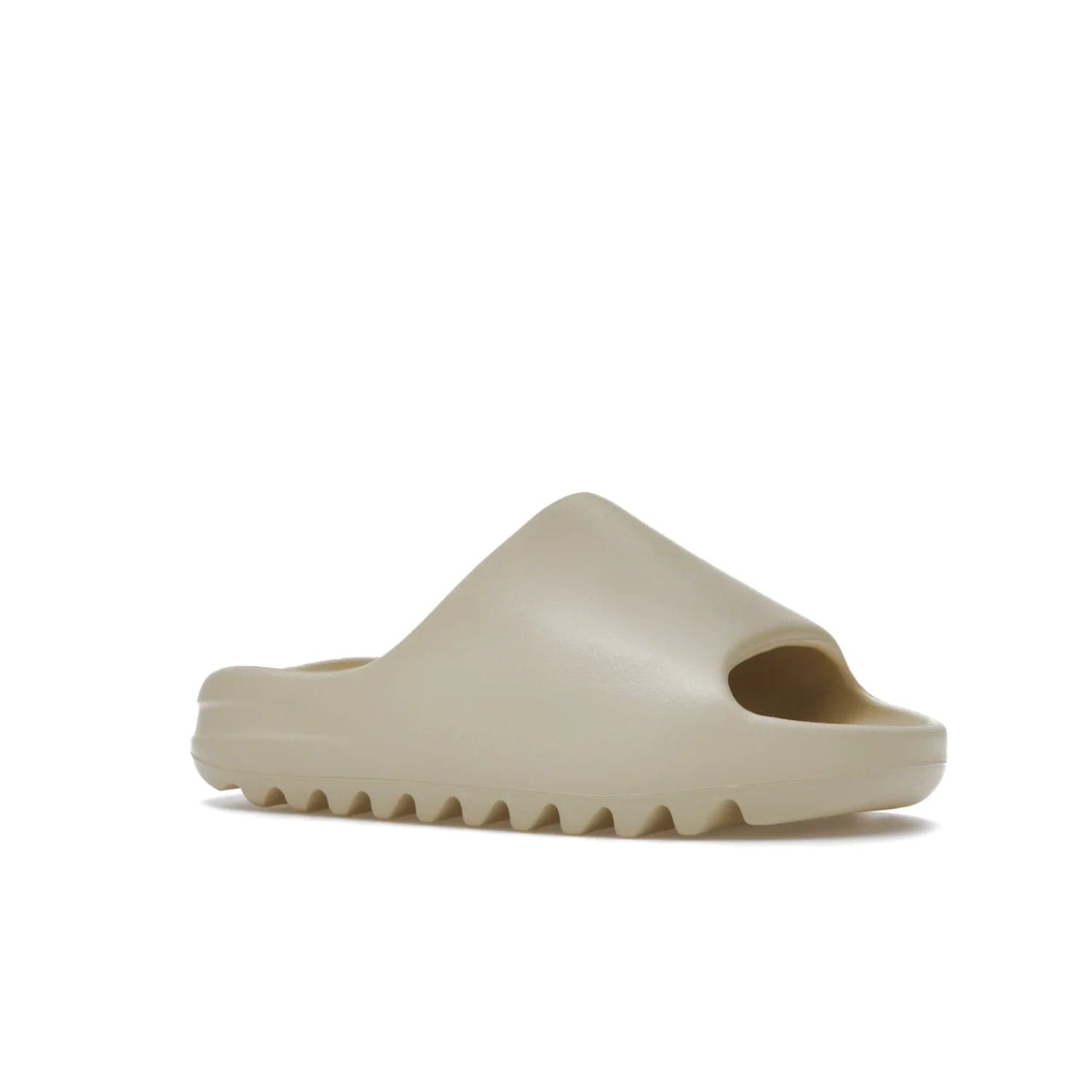 adidas Yeezy Slide Bone (2022 Restock) - Image 4 - Only at www.BallersClubKickz.com - Stay comfy with the adidas Yeezy Slide Bone - a fashionable silhouette with all-day comfort. This Bone/Bone/Bone colorway combines style and comfort with a pebbled texture and grooved sole. Restocked in May 2022, this shoe is the perfect addition to your collection.