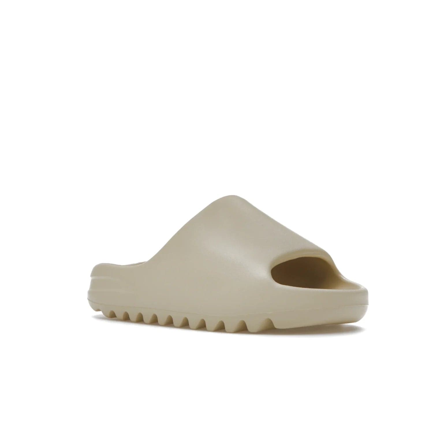 adidas Yeezy Slide Bone (2022 Restock) - Image 5 - Only at www.BallersClubKickz.com - Stay comfy with the adidas Yeezy Slide Bone - a fashionable silhouette with all-day comfort. This Bone/Bone/Bone colorway combines style and comfort with a pebbled texture and grooved sole. Restocked in May 2022, this shoe is the perfect addition to your collection.