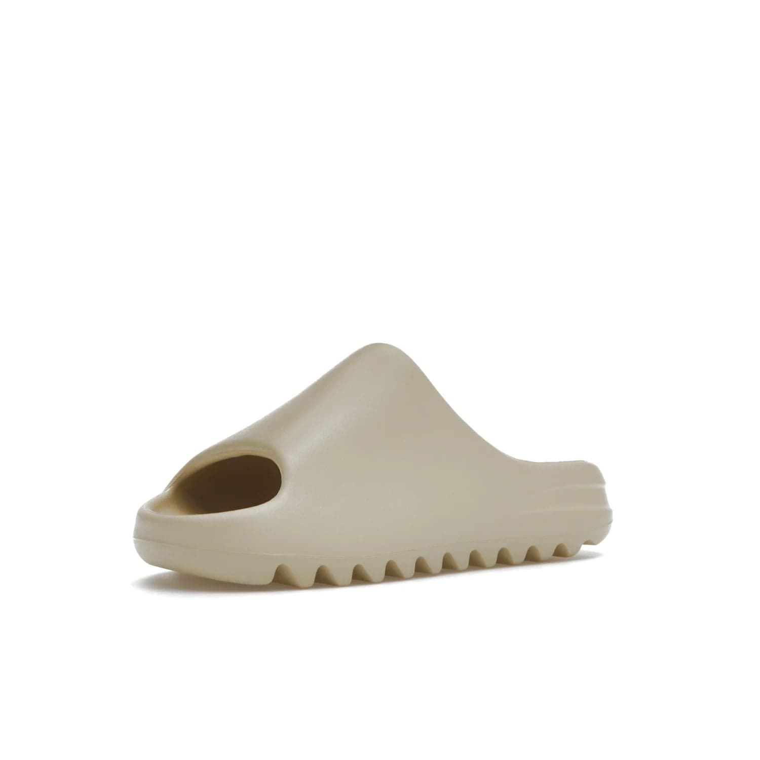 adidas Yeezy Slide Bone (2022 Restock) - Image 15 - Only at www.BallersClubKickz.com - Stay comfy with the adidas Yeezy Slide Bone - a fashionable silhouette with all-day comfort. This Bone/Bone/Bone colorway combines style and comfort with a pebbled texture and grooved sole. Restocked in May 2022, this shoe is the perfect addition to your collection.