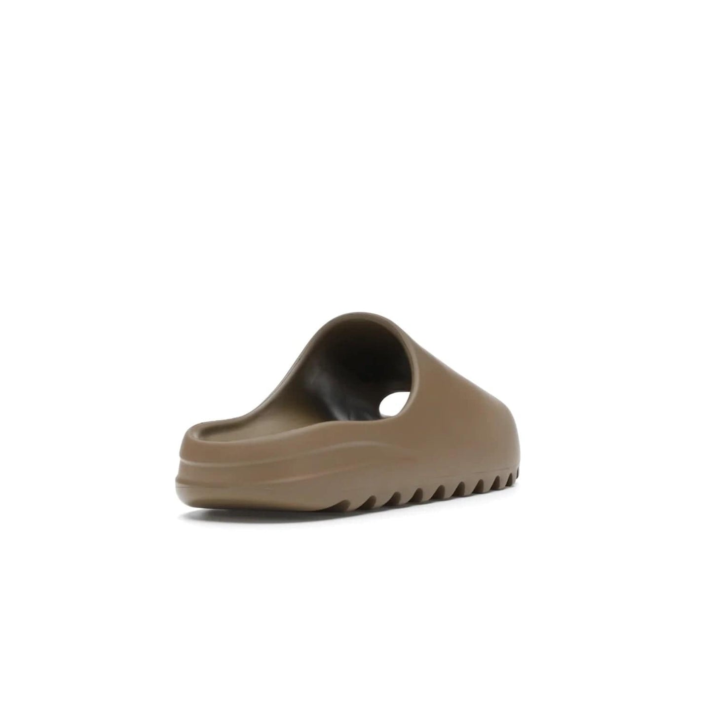 adidas Yeezy Slide Core - Image 31 - Only at www.BallersClubKickz.com - Experience lightweight comfort and cushioning with the adidas Yeezy Slide Core. Features EVA foam upper, soft footbed & grooved outsole for optimal traction & support. The Core/Core/Core colorway released April 2021.