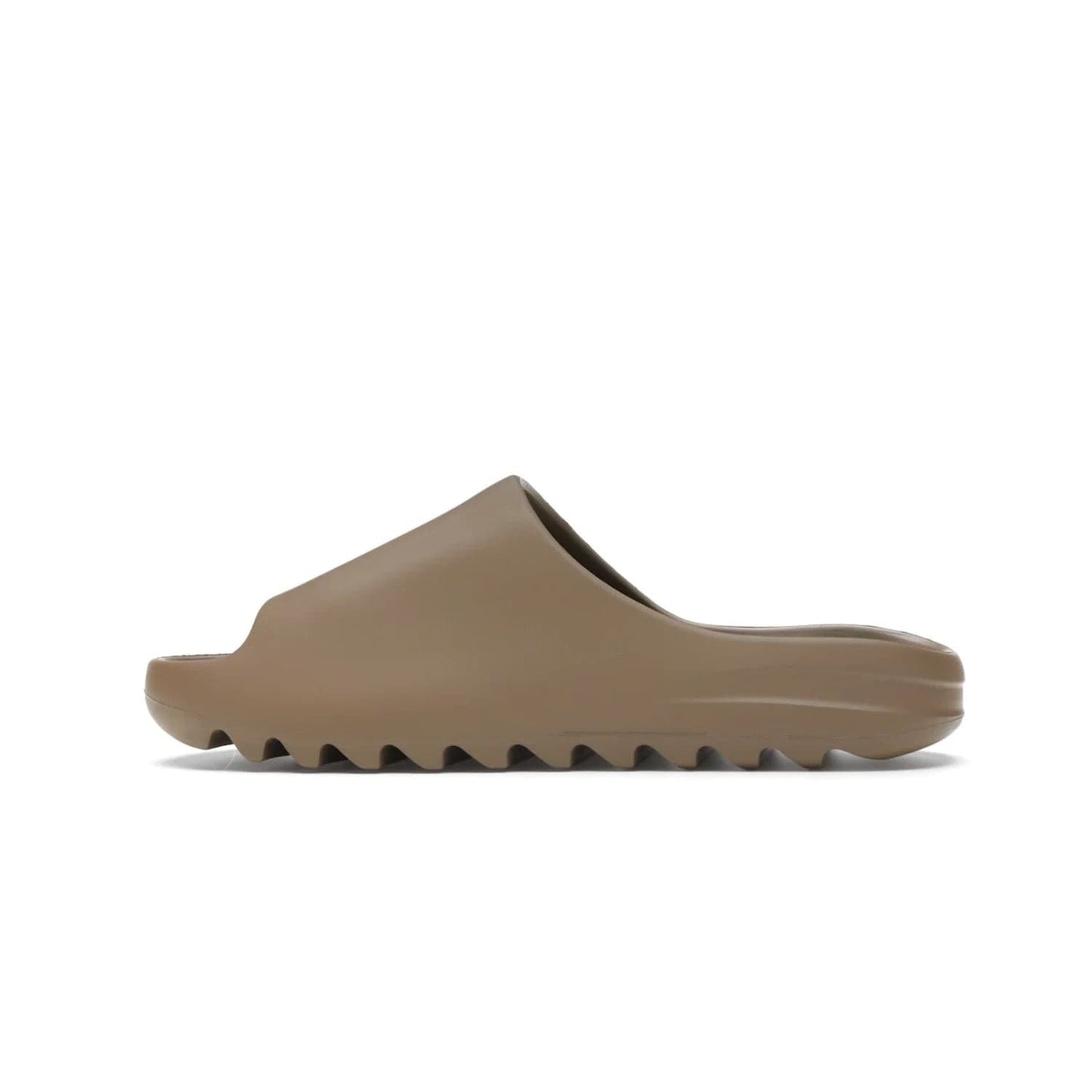 adidas Yeezy Slide Core - Image 20 - Only at www.BallersClubKickz.com - Experience lightweight comfort and cushioning with the adidas Yeezy Slide Core. Features EVA foam upper, soft footbed & grooved outsole for optimal traction & support. The Core/Core/Core colorway released April 2021.