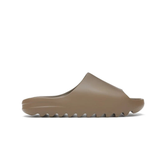 adidas Yeezy Slide Core - Image 1 - Only at www.BallersClubKickz.com - Experience lightweight comfort and cushioning with the adidas Yeezy Slide Core. Features EVA foam upper, soft footbed & grooved outsole for optimal traction & support. The Core/Core/Core colorway released April 2021.