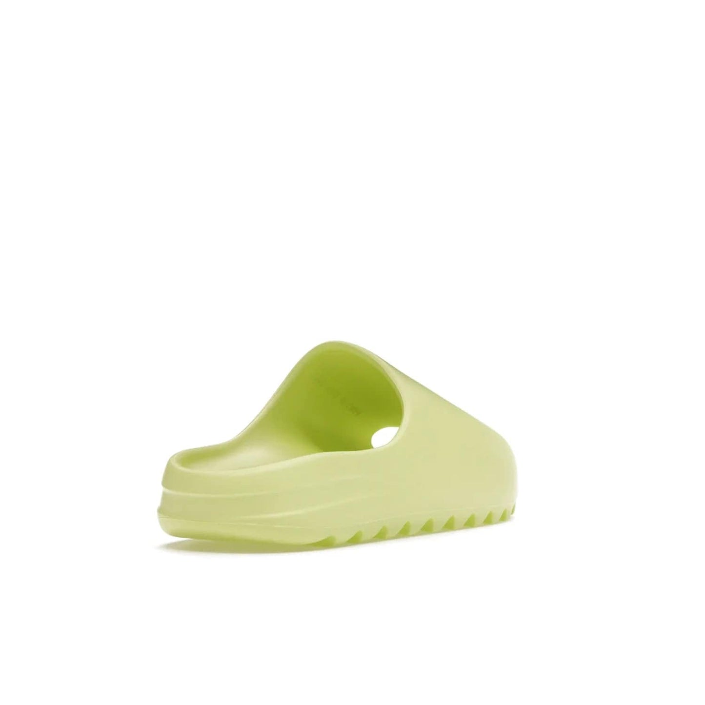 adidas Yeezy Slide Glow Green - Image 31 - Only at www.BallersClubKickz.com - Experience an unexpected summer style with the adidas Yeezy Slide Glow Green. This limited edition slide sandal provides a lightweight and durable construction and a bold Glow Green hue. Strategic grooves enhance traction and provide all-day comfort. Make a statement with the adidas Yeezy Slide Glow Green.