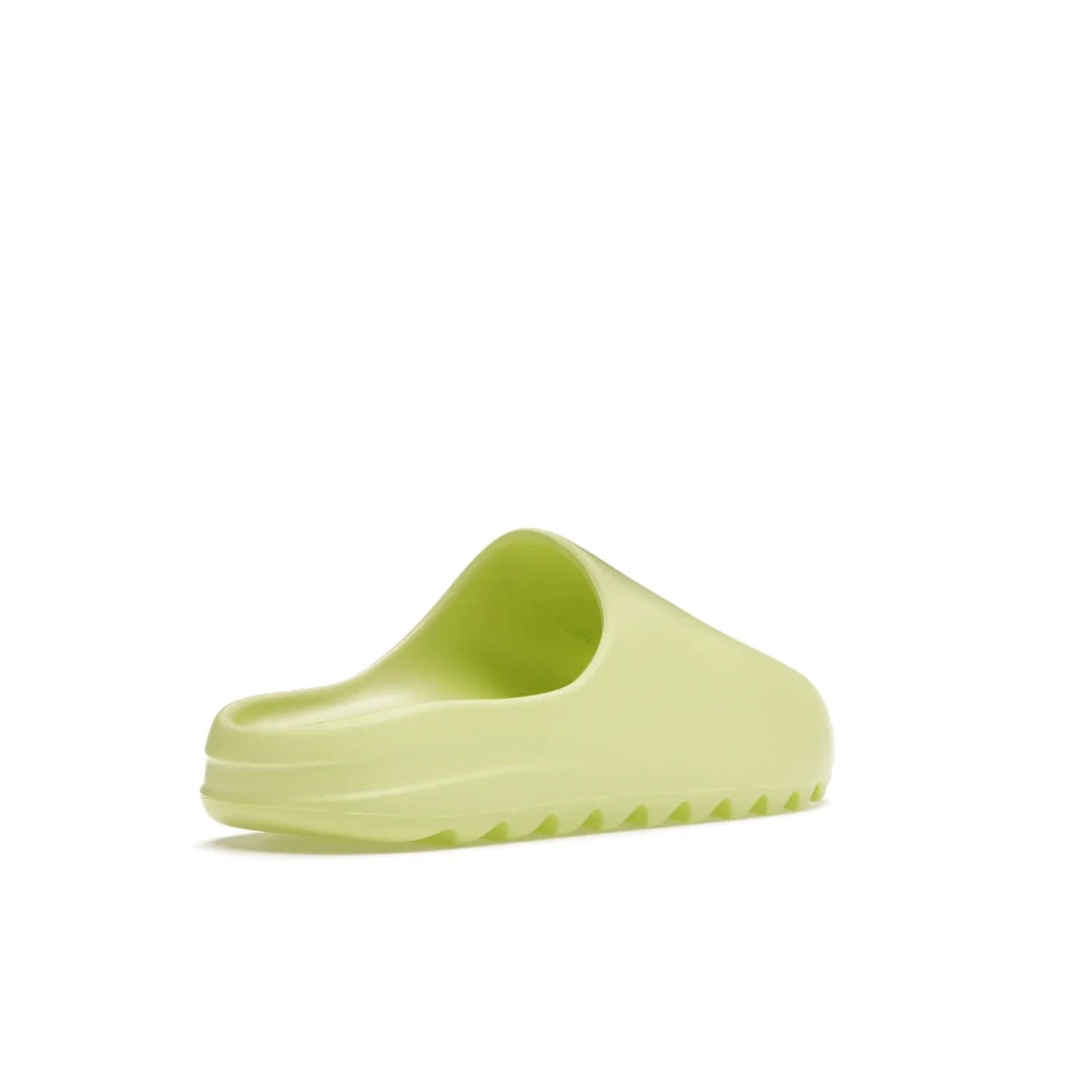 adidas Yeezy Slide Glow Green - Image 32 - Only at www.BallersClubKickz.com - Experience an unexpected summer style with the adidas Yeezy Slide Glow Green. This limited edition slide sandal provides a lightweight and durable construction and a bold Glow Green hue. Strategic grooves enhance traction and provide all-day comfort. Make a statement with the adidas Yeezy Slide Glow Green.