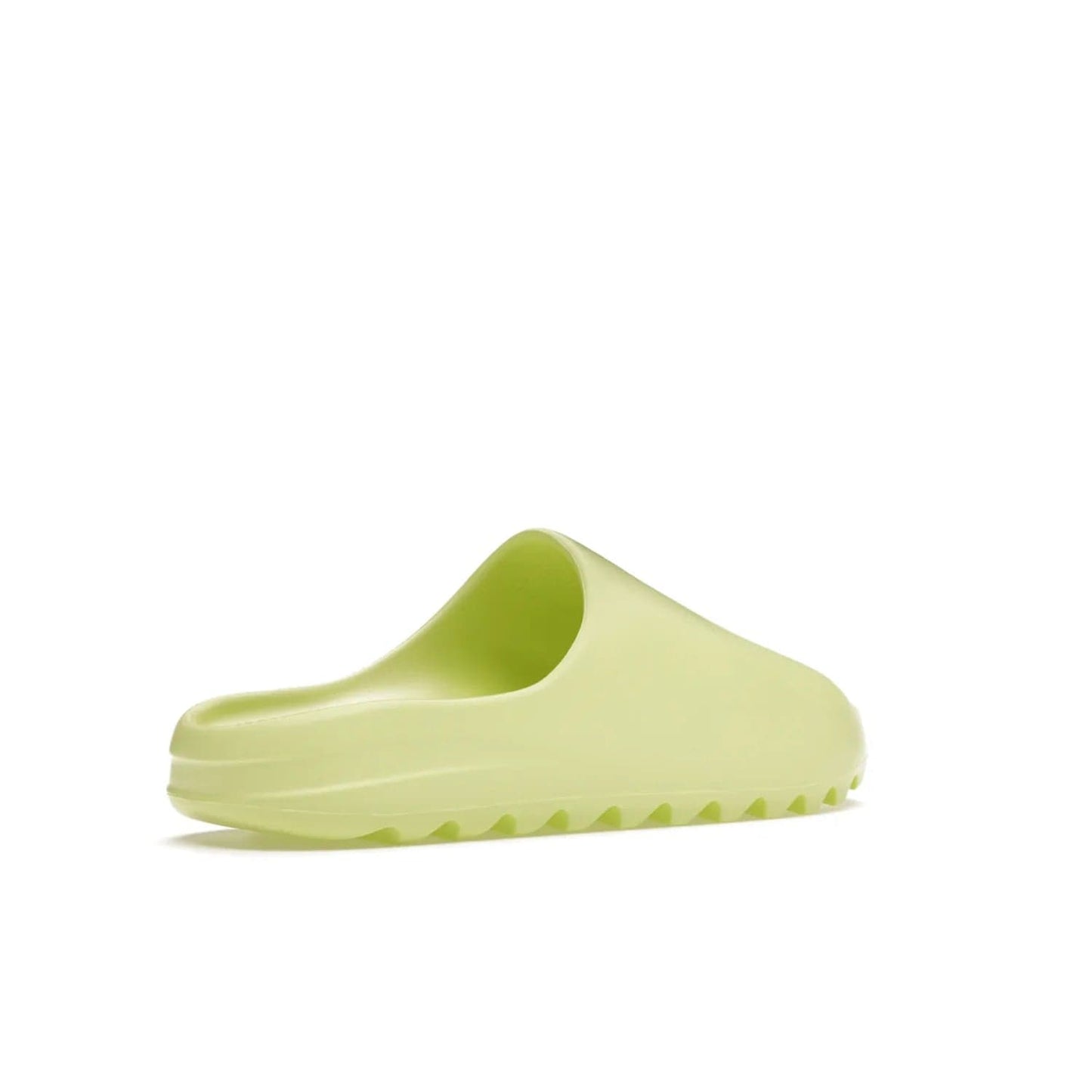 adidas Yeezy Slide Glow Green - Image 33 - Only at www.BallersClubKickz.com - Experience an unexpected summer style with the adidas Yeezy Slide Glow Green. This limited edition slide sandal provides a lightweight and durable construction and a bold Glow Green hue. Strategic grooves enhance traction and provide all-day comfort. Make a statement with the adidas Yeezy Slide Glow Green.