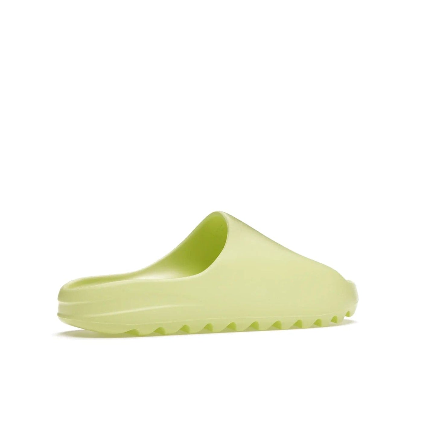 adidas Yeezy Slide Glow Green - Image 34 - Only at www.BallersClubKickz.com - Experience an unexpected summer style with the adidas Yeezy Slide Glow Green. This limited edition slide sandal provides a lightweight and durable construction and a bold Glow Green hue. Strategic grooves enhance traction and provide all-day comfort. Make a statement with the adidas Yeezy Slide Glow Green.