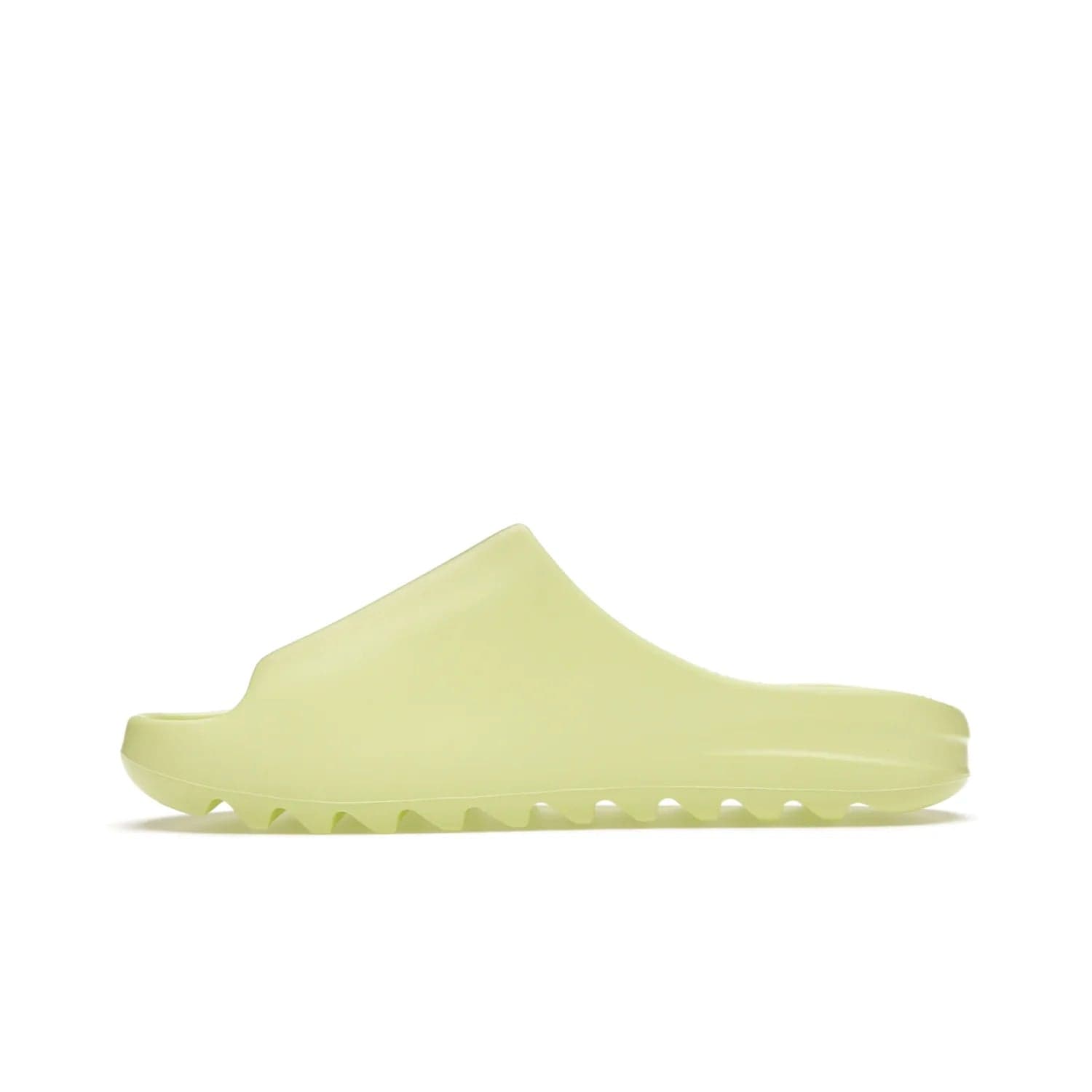 adidas Yeezy Slide Glow Green - Image 19 - Only at www.BallersClubKickz.com - Experience an unexpected summer style with the adidas Yeezy Slide Glow Green. This limited edition slide sandal provides a lightweight and durable construction and a bold Glow Green hue. Strategic grooves enhance traction and provide all-day comfort. Make a statement with the adidas Yeezy Slide Glow Green.