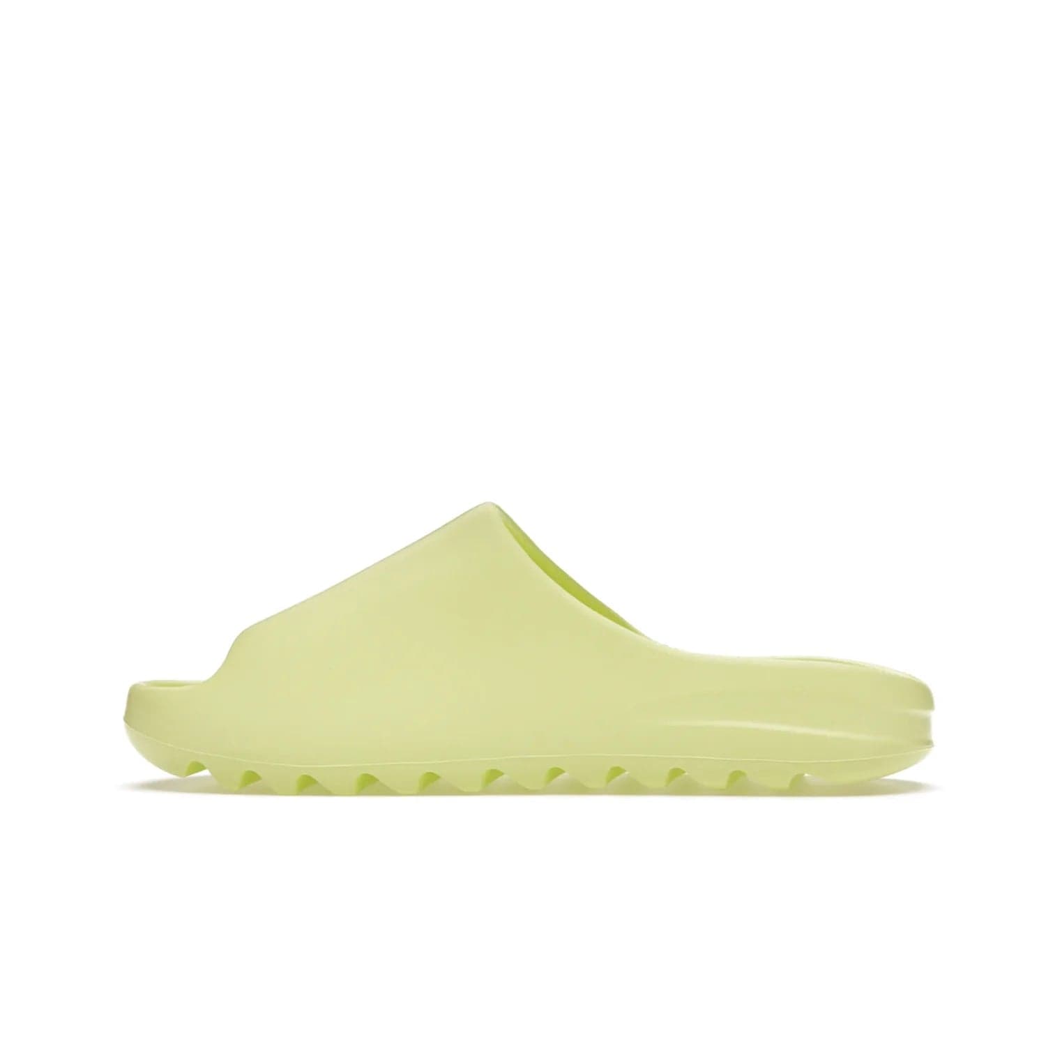 adidas Yeezy Slide Glow Green - Image 20 - Only at www.BallersClubKickz.com - Experience an unexpected summer style with the adidas Yeezy Slide Glow Green. This limited edition slide sandal provides a lightweight and durable construction and a bold Glow Green hue. Strategic grooves enhance traction and provide all-day comfort. Make a statement with the adidas Yeezy Slide Glow Green.