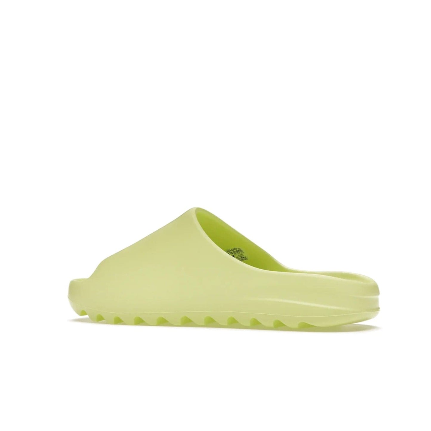 adidas Yeezy Slide Glow Green - Image 22 - Only at www.BallersClubKickz.com - Experience an unexpected summer style with the adidas Yeezy Slide Glow Green. This limited edition slide sandal provides a lightweight and durable construction and a bold Glow Green hue. Strategic grooves enhance traction and provide all-day comfort. Make a statement with the adidas Yeezy Slide Glow Green.