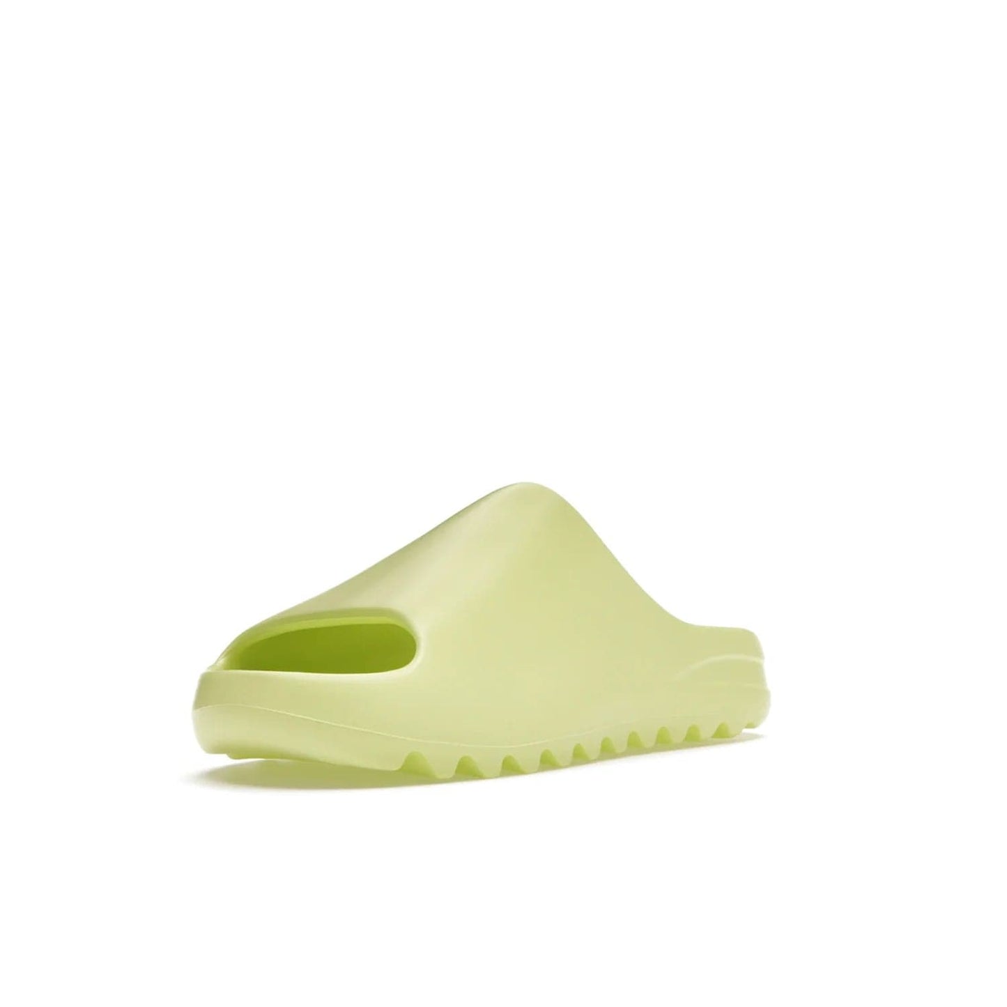 adidas Yeezy Slide Glow Green - Image 14 - Only at www.BallersClubKickz.com - Experience an unexpected summer style with the adidas Yeezy Slide Glow Green. This limited edition slide sandal provides a lightweight and durable construction and a bold Glow Green hue. Strategic grooves enhance traction and provide all-day comfort. Make a statement with the adidas Yeezy Slide Glow Green.