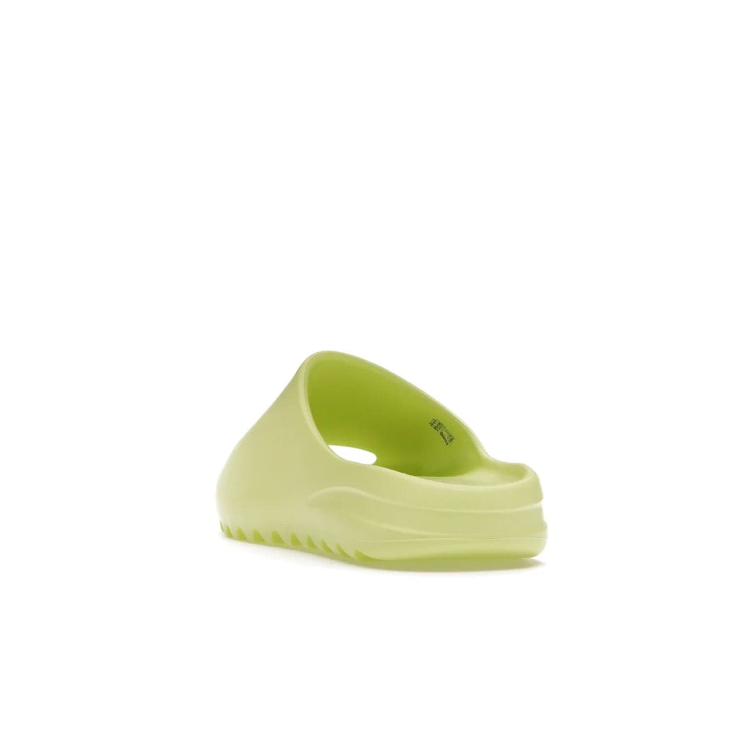adidas Yeezy Slide Glow Green - Image 26 - Only at www.BallersClubKickz.com - Experience an unexpected summer style with the adidas Yeezy Slide Glow Green. This limited edition slide sandal provides a lightweight and durable construction and a bold Glow Green hue. Strategic grooves enhance traction and provide all-day comfort. Make a statement with the adidas Yeezy Slide Glow Green.