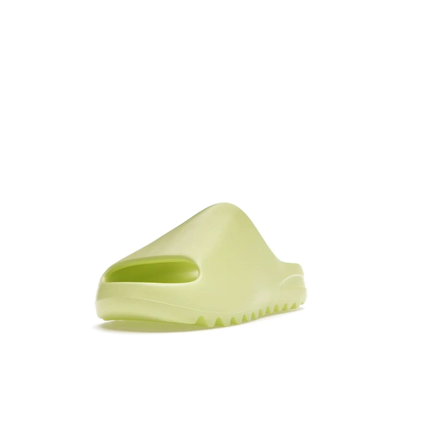 adidas Yeezy Slide Glow Green - Image 13 - Only at www.BallersClubKickz.com - Experience an unexpected summer style with the adidas Yeezy Slide Glow Green. This limited edition slide sandal provides a lightweight and durable construction and a bold Glow Green hue. Strategic grooves enhance traction and provide all-day comfort. Make a statement with the adidas Yeezy Slide Glow Green.