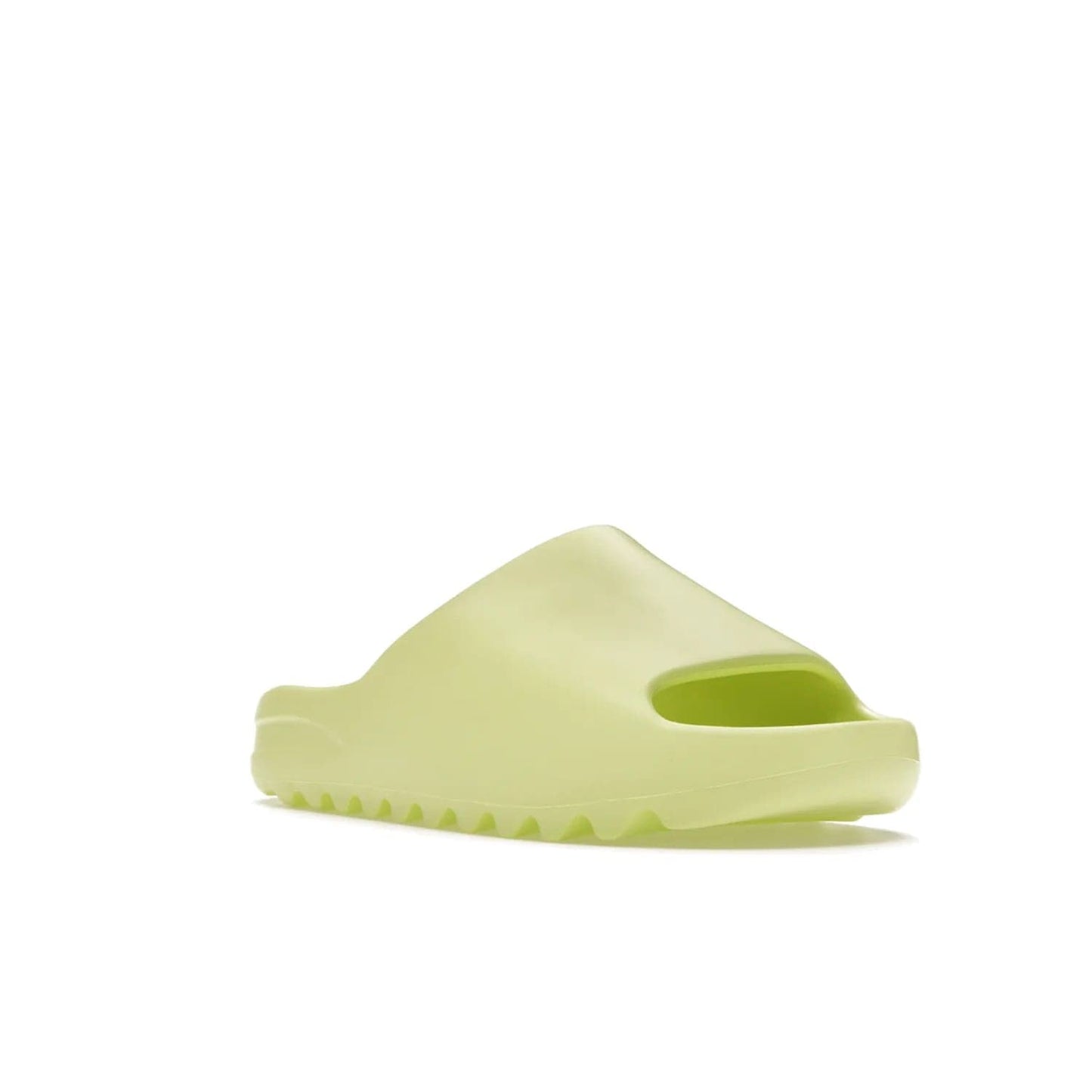 adidas Yeezy Slide Glow Green - Image 6 - Only at www.BallersClubKickz.com - Experience an unexpected summer style with the adidas Yeezy Slide Glow Green. This limited edition slide sandal provides a lightweight and durable construction and a bold Glow Green hue. Strategic grooves enhance traction and provide all-day comfort. Make a statement with the adidas Yeezy Slide Glow Green.