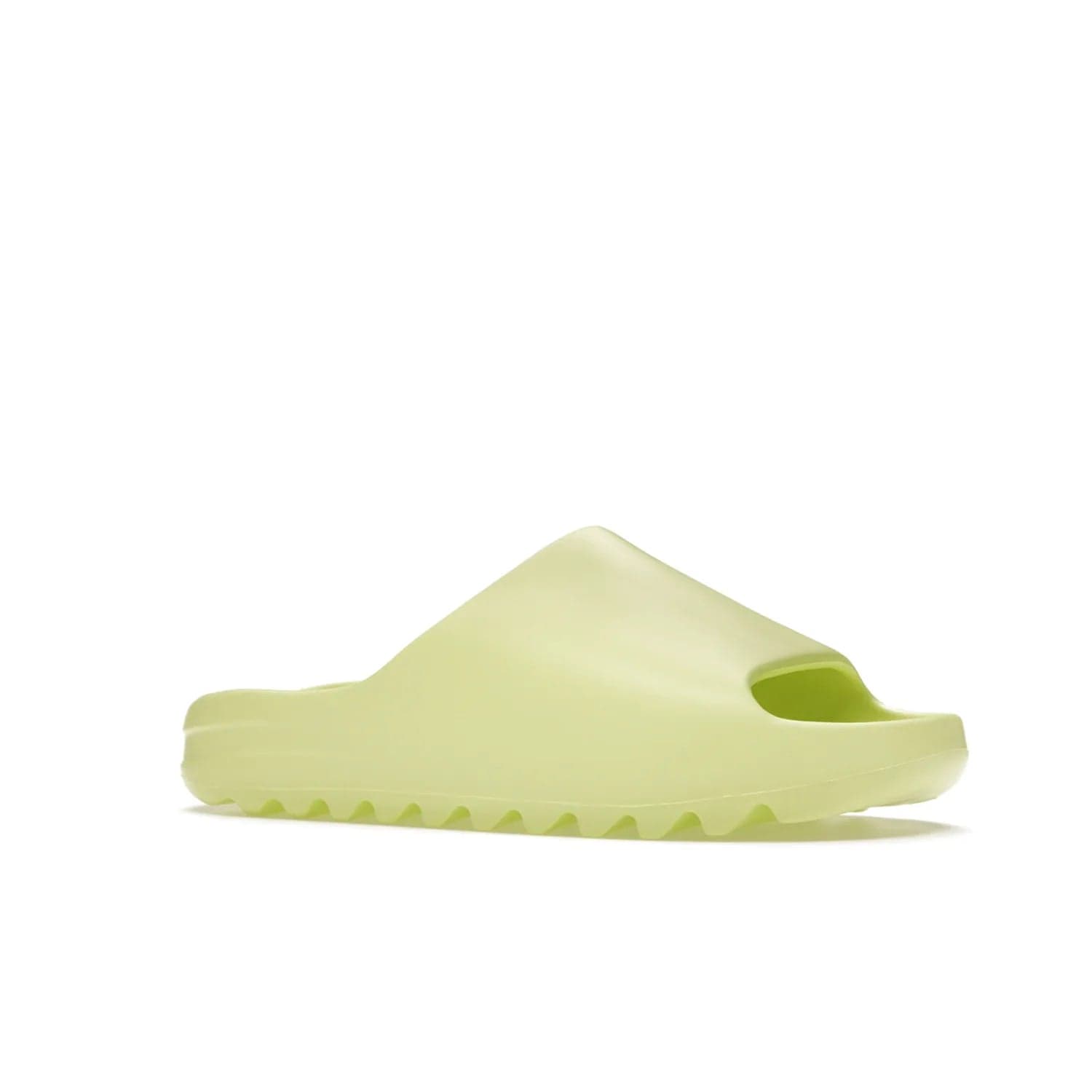 adidas Yeezy Slide Glow Green - Image 4 - Only at www.BallersClubKickz.com - Experience an unexpected summer style with the adidas Yeezy Slide Glow Green. This limited edition slide sandal provides a lightweight and durable construction and a bold Glow Green hue. Strategic grooves enhance traction and provide all-day comfort. Make a statement with the adidas Yeezy Slide Glow Green.