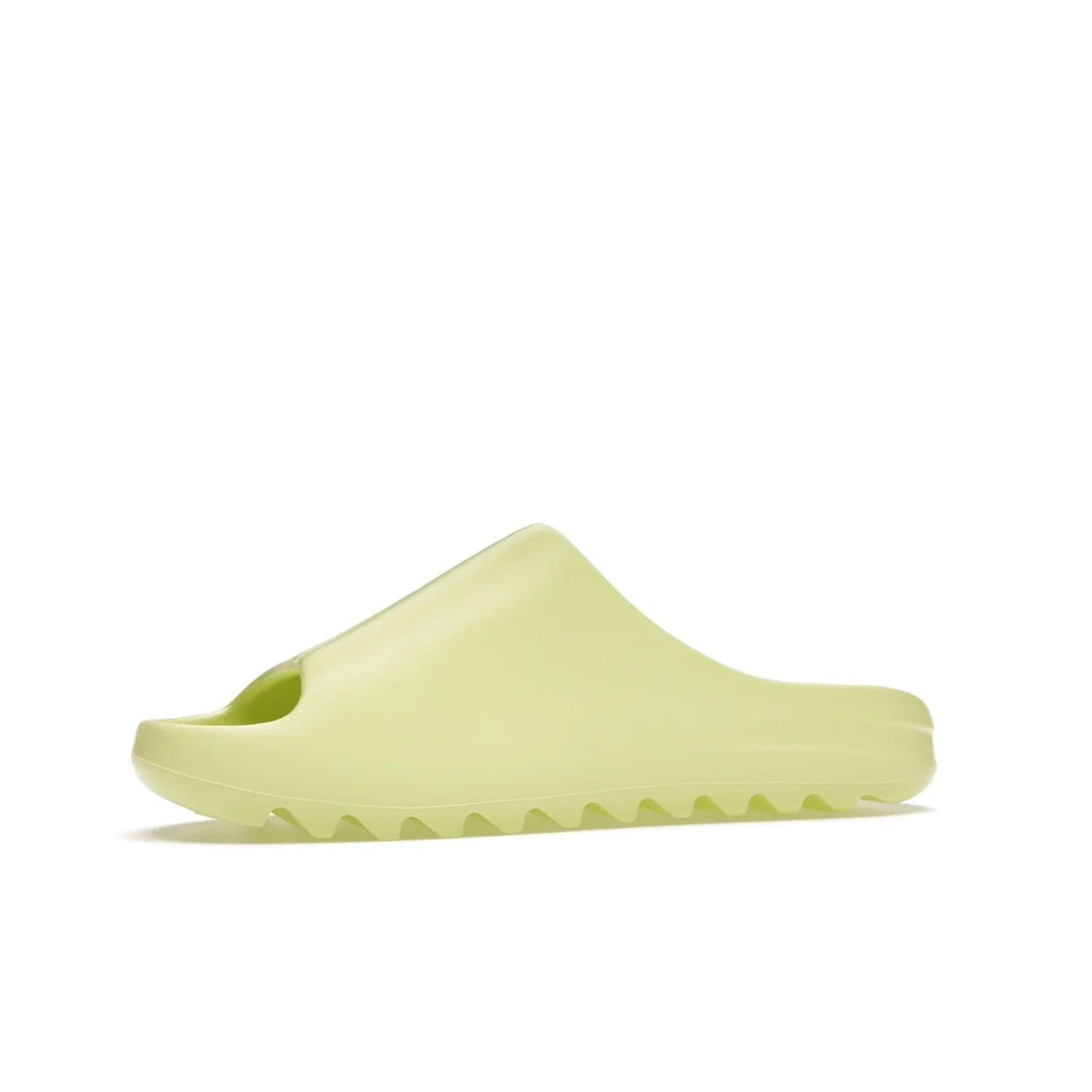 adidas Yeezy Slide Glow Green - Image 17 - Only at www.BallersClubKickz.com - Experience an unexpected summer style with the adidas Yeezy Slide Glow Green. This limited edition slide sandal provides a lightweight and durable construction and a bold Glow Green hue. Strategic grooves enhance traction and provide all-day comfort. Make a statement with the adidas Yeezy Slide Glow Green.