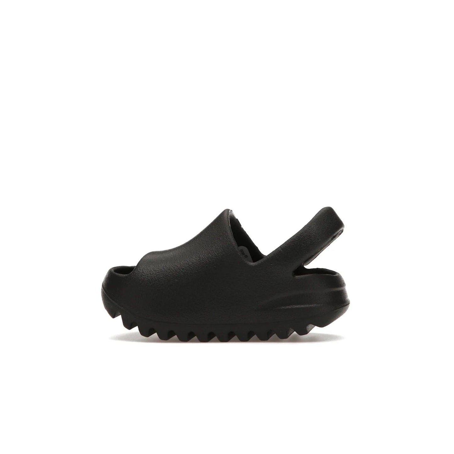 adidas Yeezy Slide Onyx (Infants) - Image 20 - Only at www.BallersClubKickz.com - The Adidas Yeezy Slide Onyx (Infant) is a classic silhouette with unique features and durable EVA foam. Released in May 2021 with a starting price of $70, it's no wonder it quickly gained popularity with its cool, minimalist look.