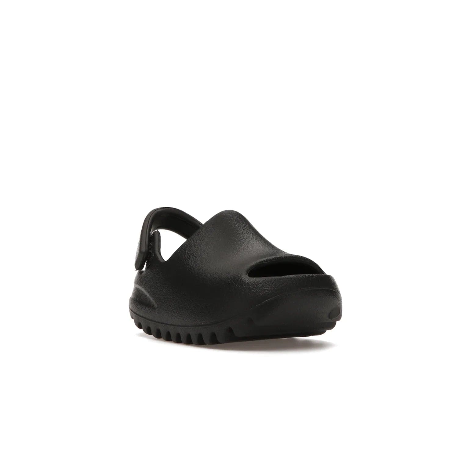 adidas Yeezy Slide Onyx (Infants) - Image 6 - Only at www.BallersClubKickz.com - The Adidas Yeezy Slide Onyx (Infant) is a classic silhouette with unique features and durable EVA foam. Released in May 2021 with a starting price of $70, it's no wonder it quickly gained popularity with its cool, minimalist look.
