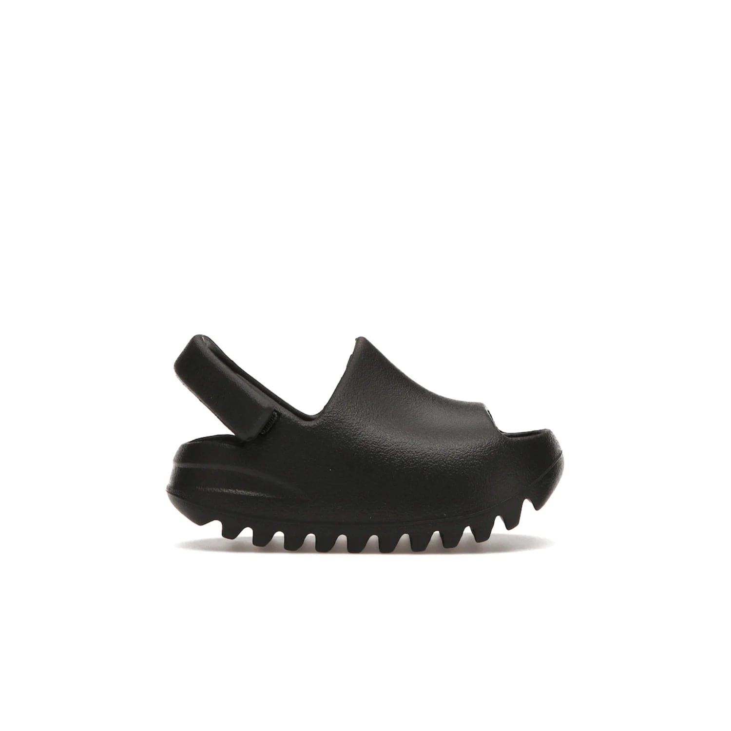 adidas Yeezy Slide Onyx (Infants) - Image 1 - Only at www.BallersClubKickz.com - The Adidas Yeezy Slide Onyx (Infant) is a classic silhouette with unique features and durable EVA foam. Released in May 2021 with a starting price of $70, it's no wonder it quickly gained popularity with its cool, minimalist look.
