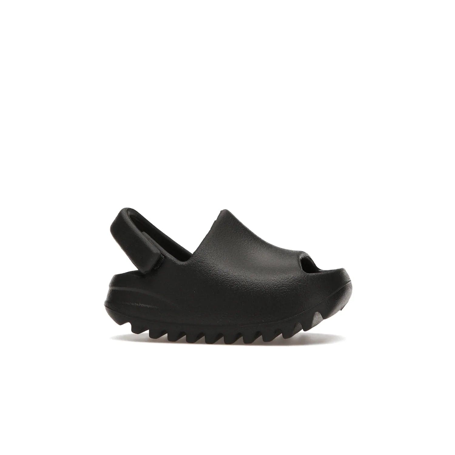 adidas Yeezy Slide Onyx (Infants) - Image 2 - Only at www.BallersClubKickz.com - The Adidas Yeezy Slide Onyx (Infant) is a classic silhouette with unique features and durable EVA foam. Released in May 2021 with a starting price of $70, it's no wonder it quickly gained popularity with its cool, minimalist look.