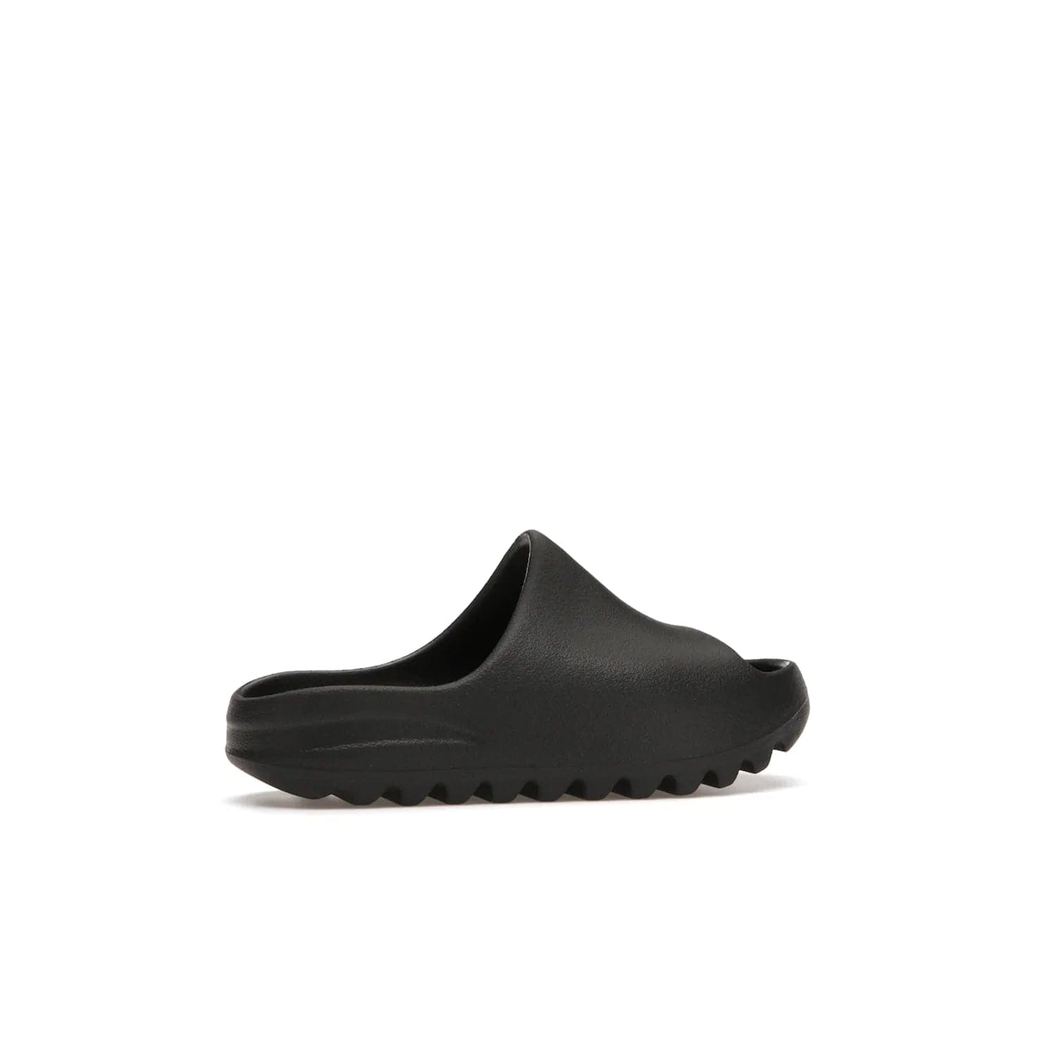 adidas Yeezy Slide Onyx (Kids) - Image 35 - Only at www.BallersClubKickz.com - adidas Yeezy Slide Onyx (Kids): Comfortable foam construction with textured surface and iconic three-stripe logo. Breathable, open-toe design and deep grooves for traction. Released in March 2021 at $50.